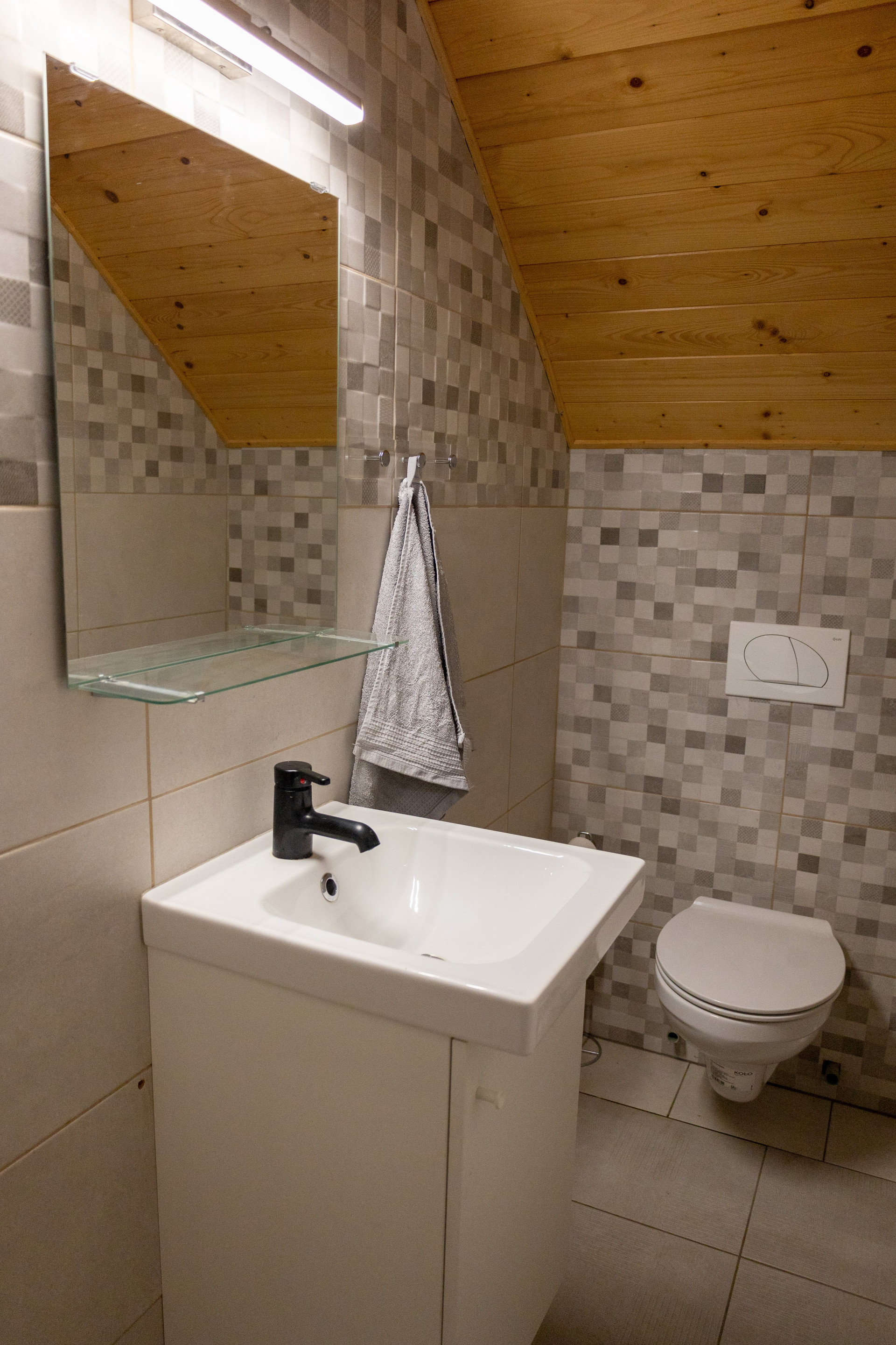 Compact bathroom with sink and toilet