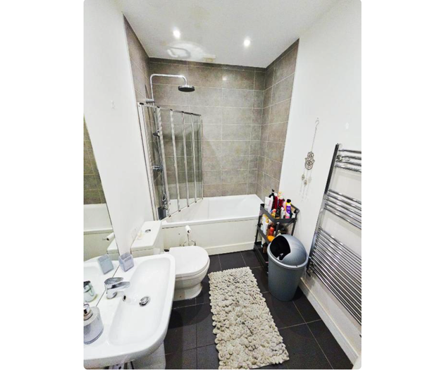 Bathroom with bathtub and shower