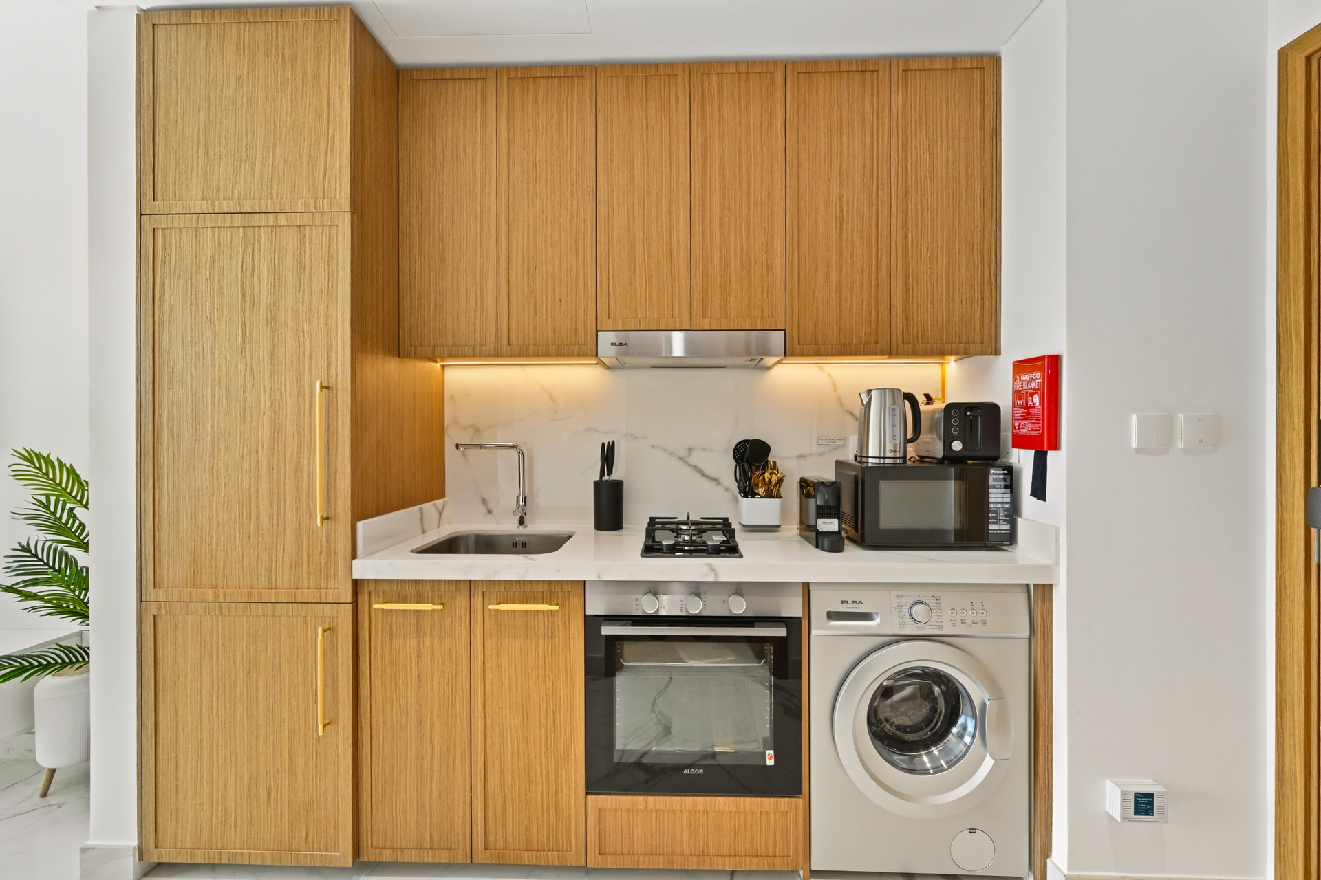 Kitchen with appliances and cabinetry