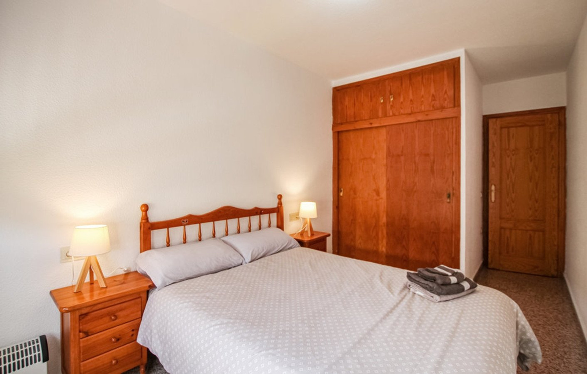 Bedroom with wooden wardrobe