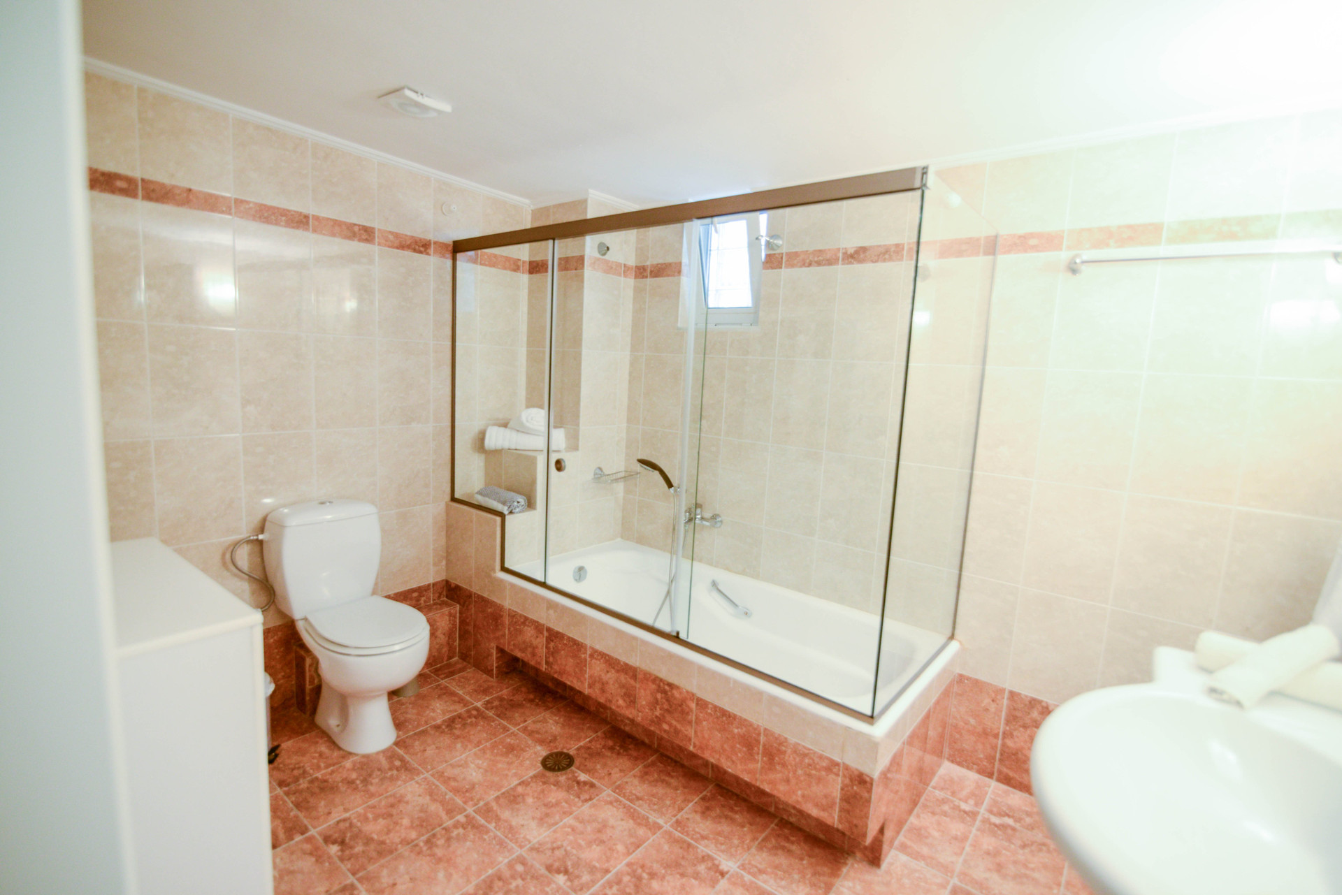 Bathroom with bathtub and shower