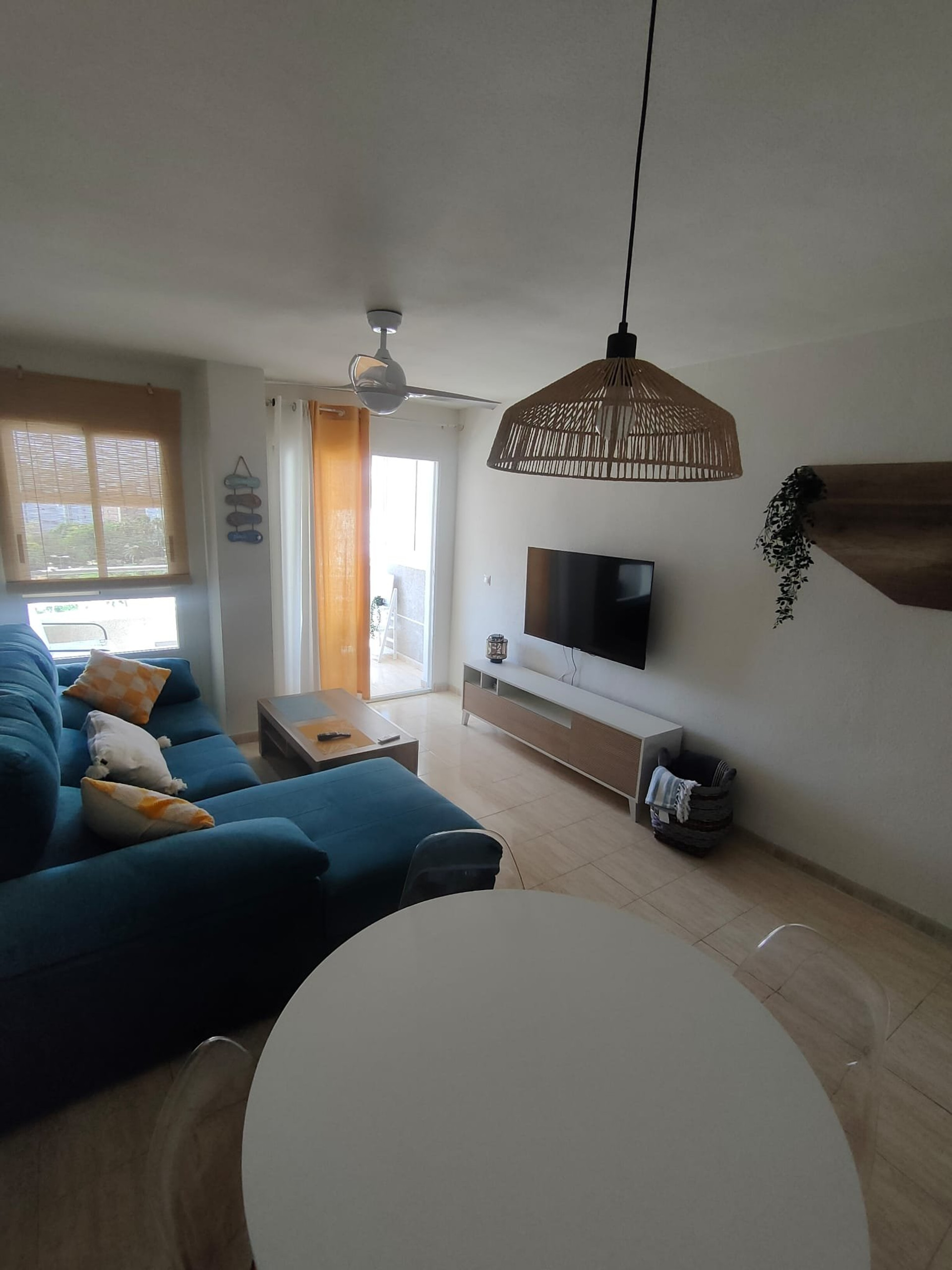 Living room with TV and dining