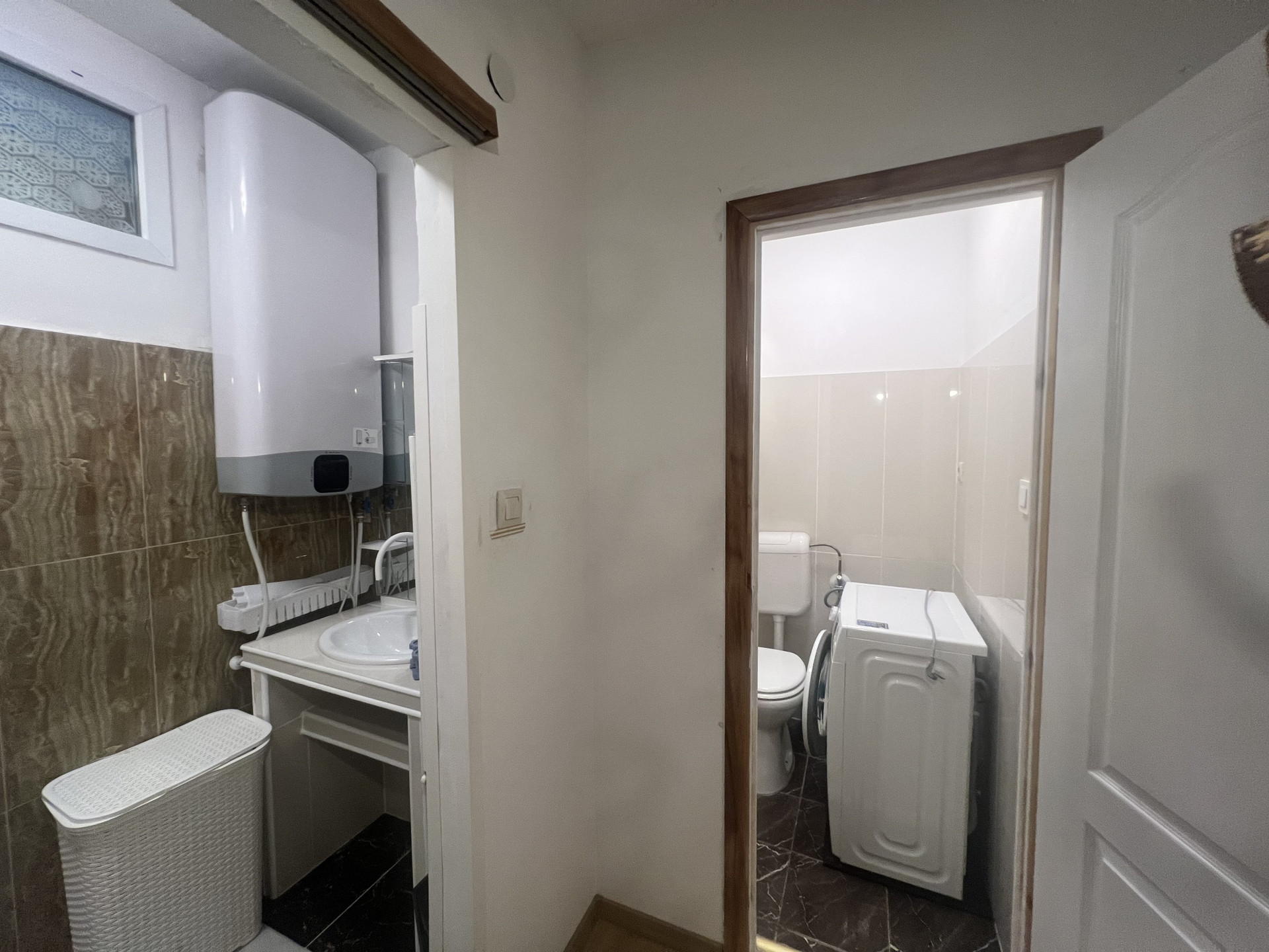 Bathroom with sink and washer