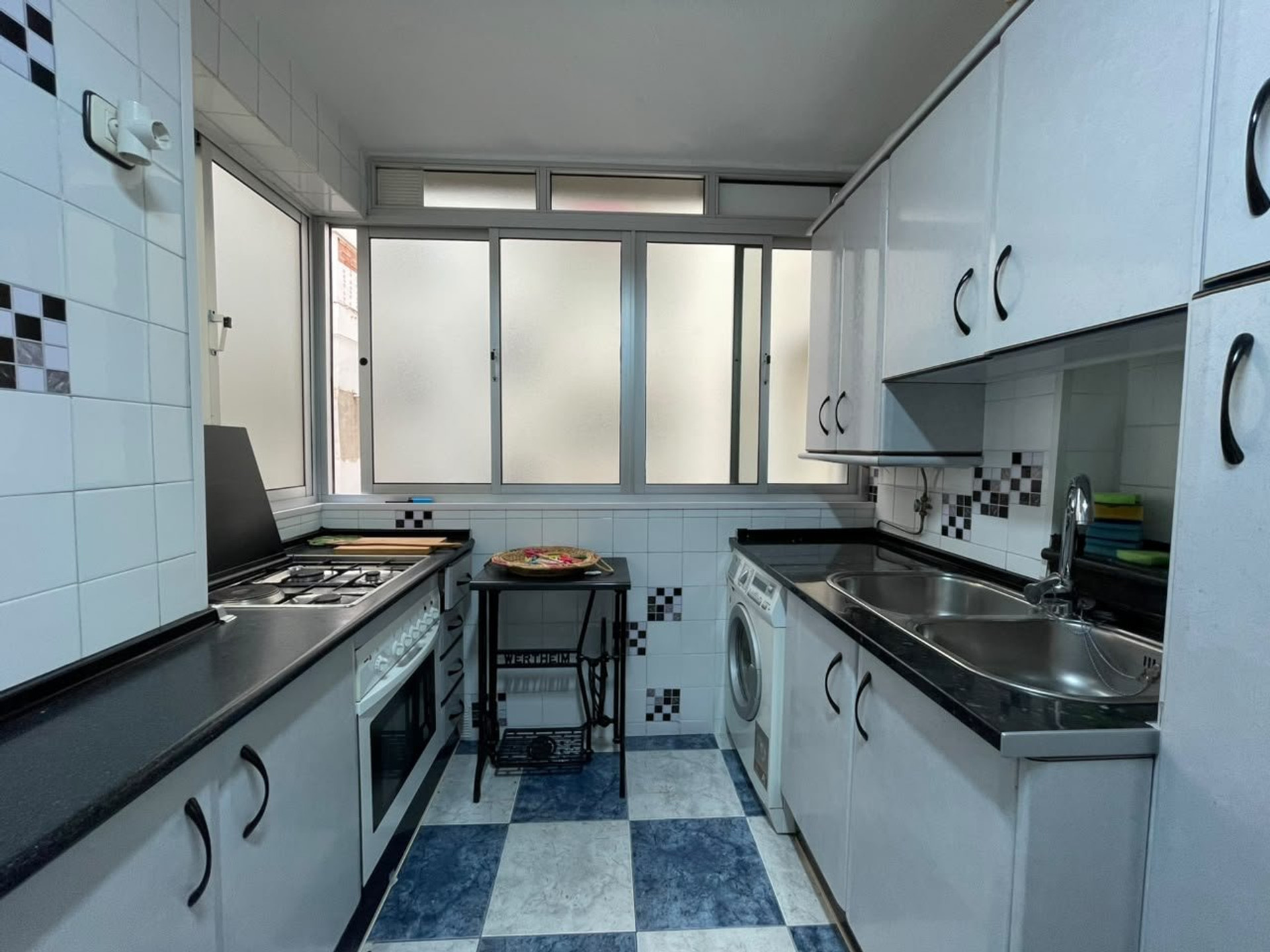 Galley kitchen with appliances