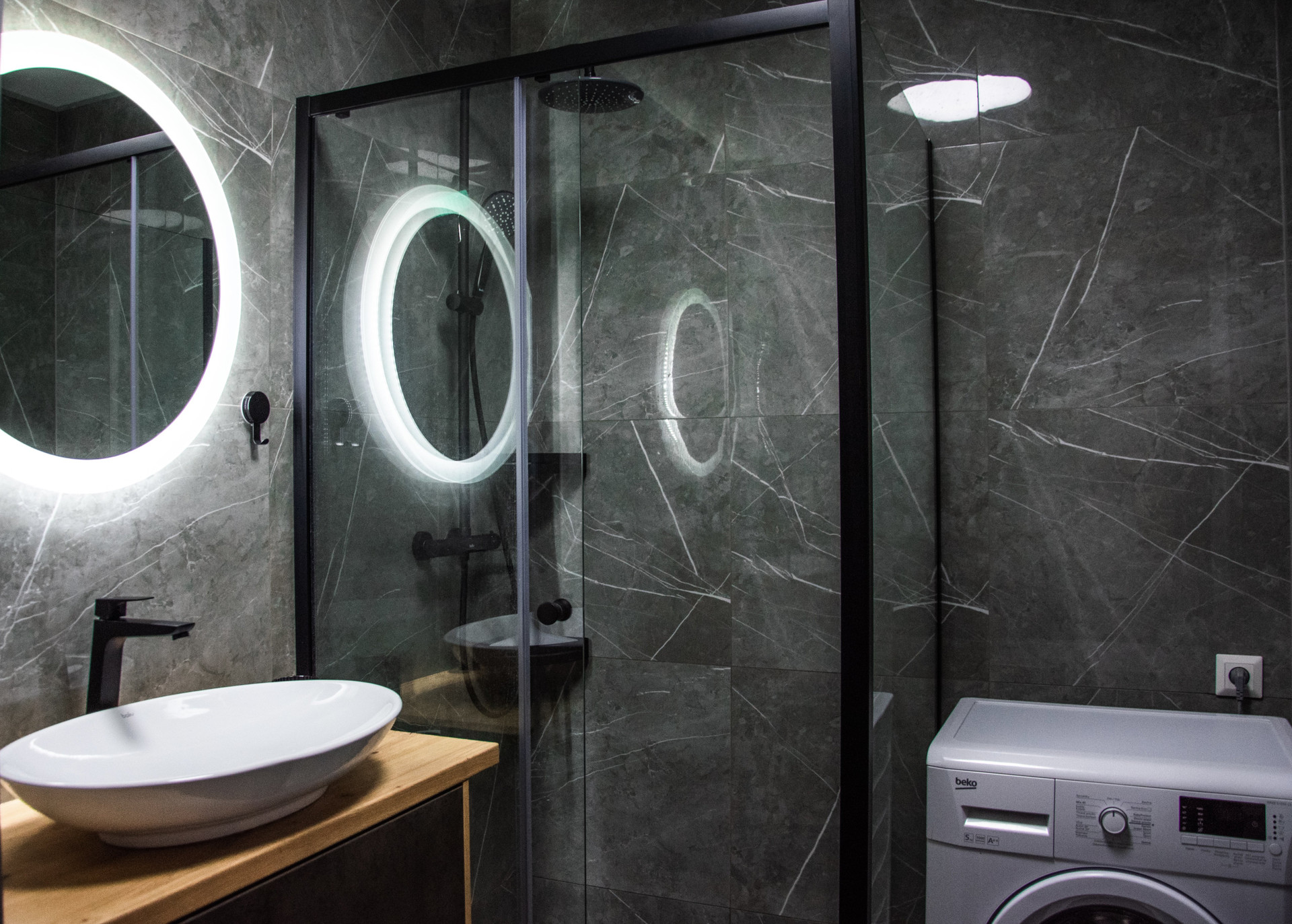 Dark marble bathroom with shower