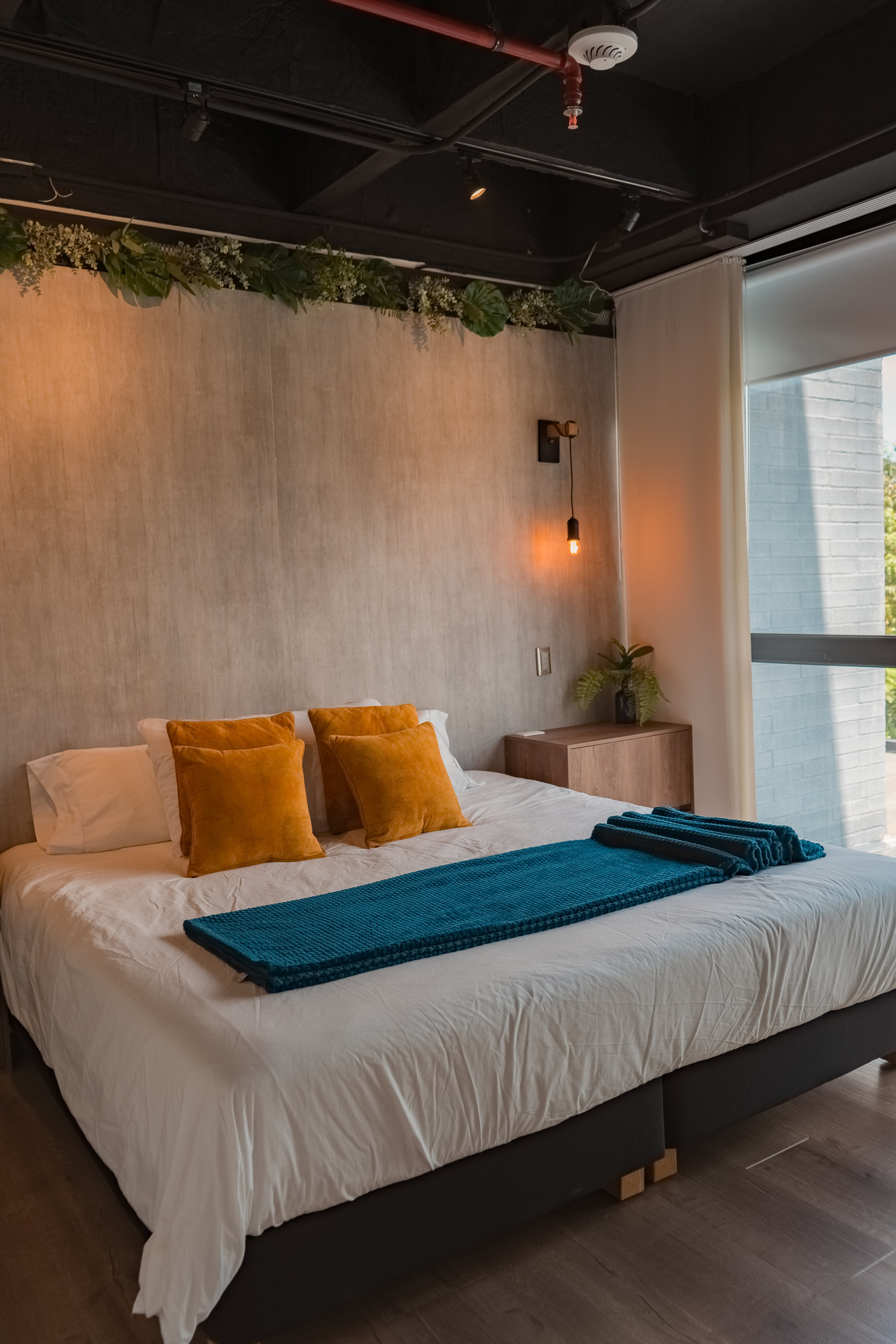 Bedroom with orange pillows