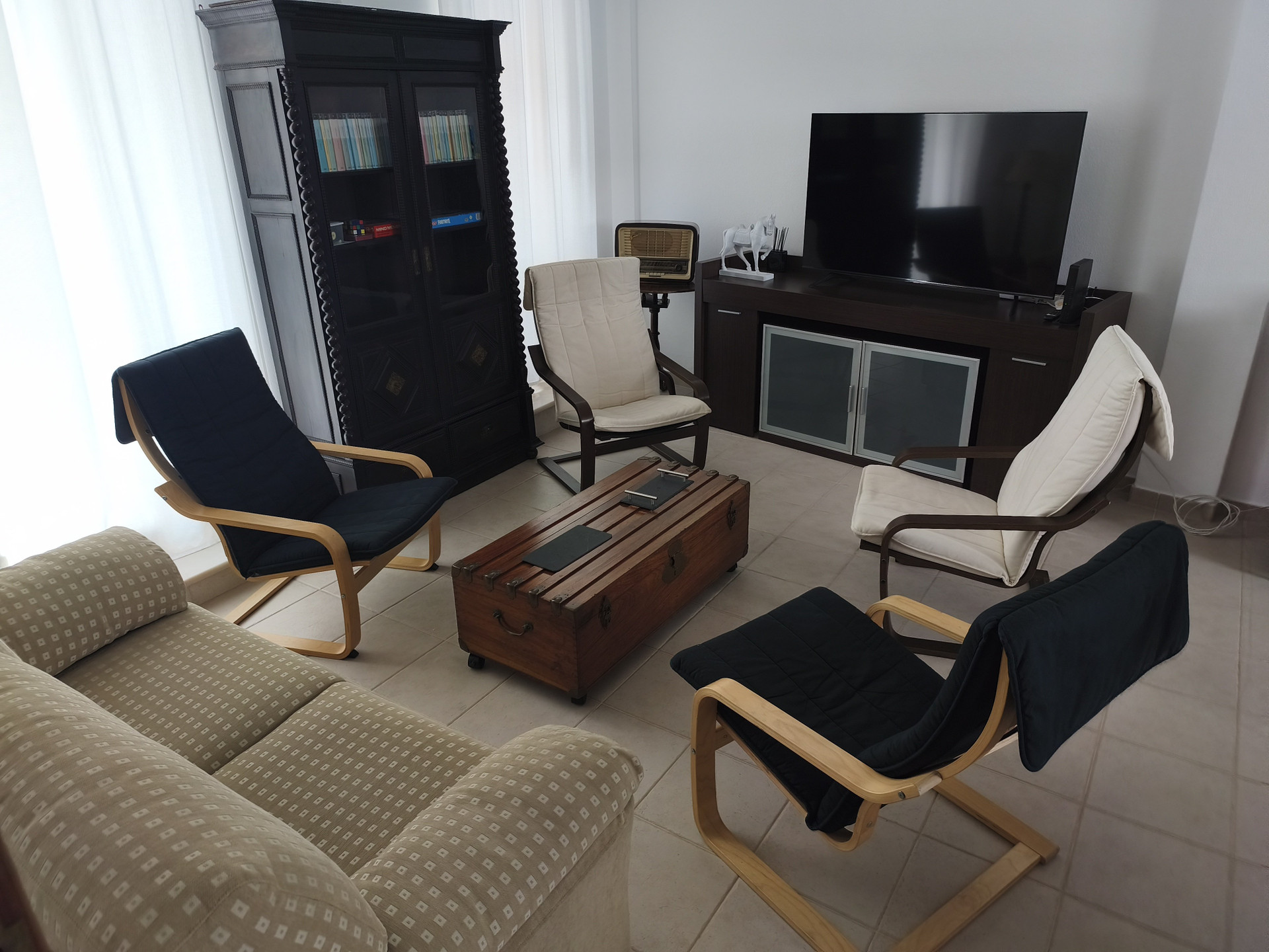 Living room with sofa and armchairs