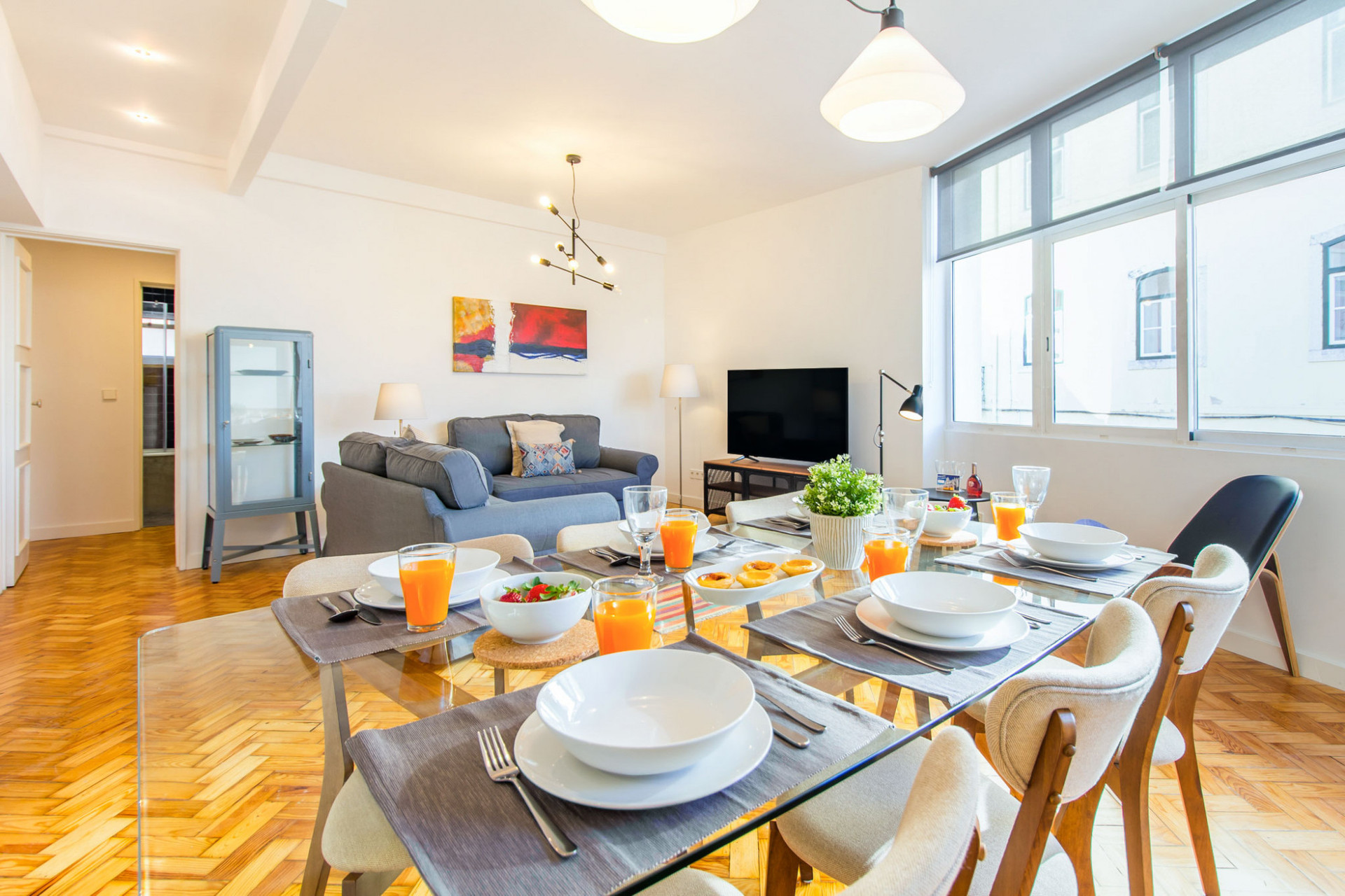 Bright dining room with living area