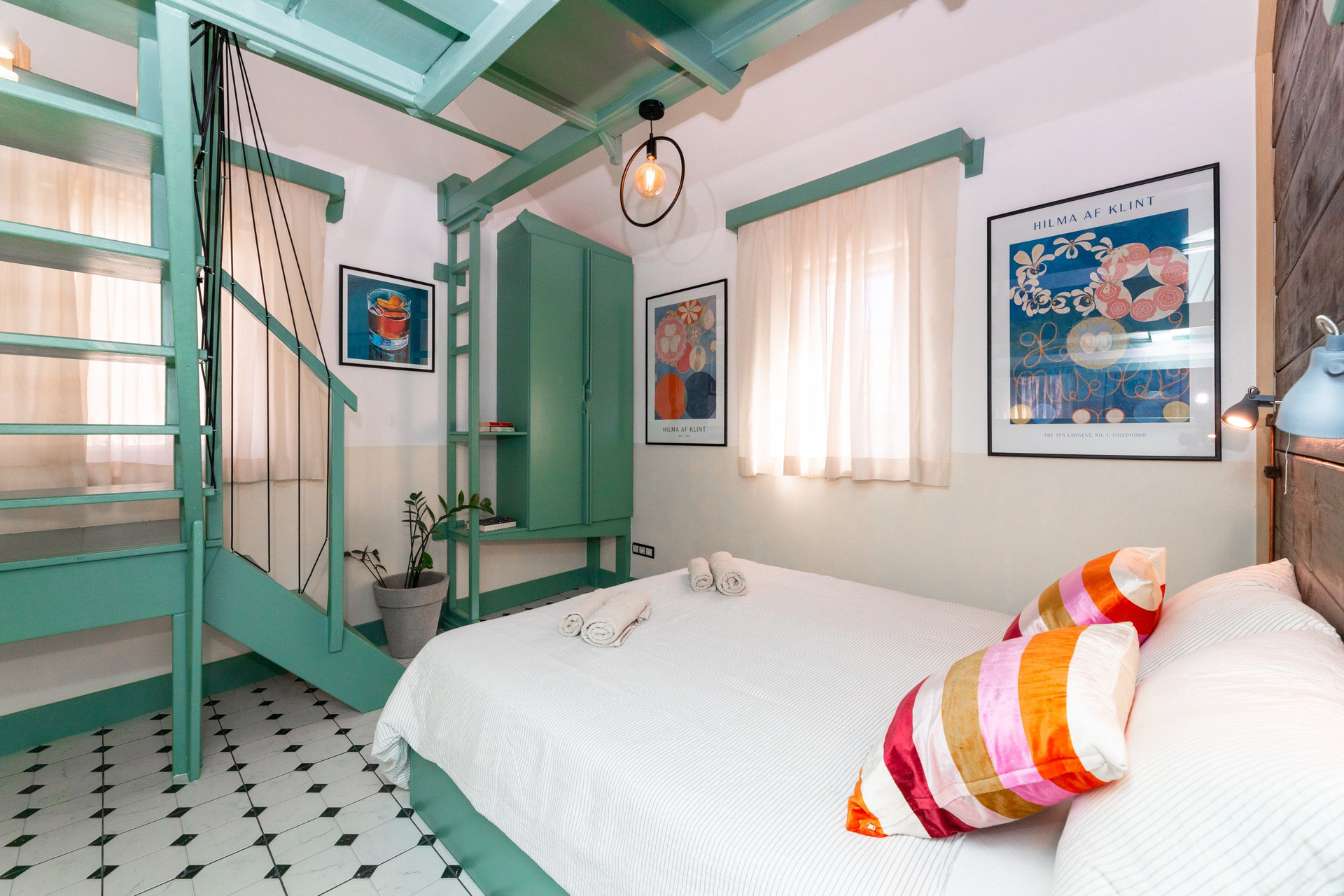 Bedroom with wardrobe and art