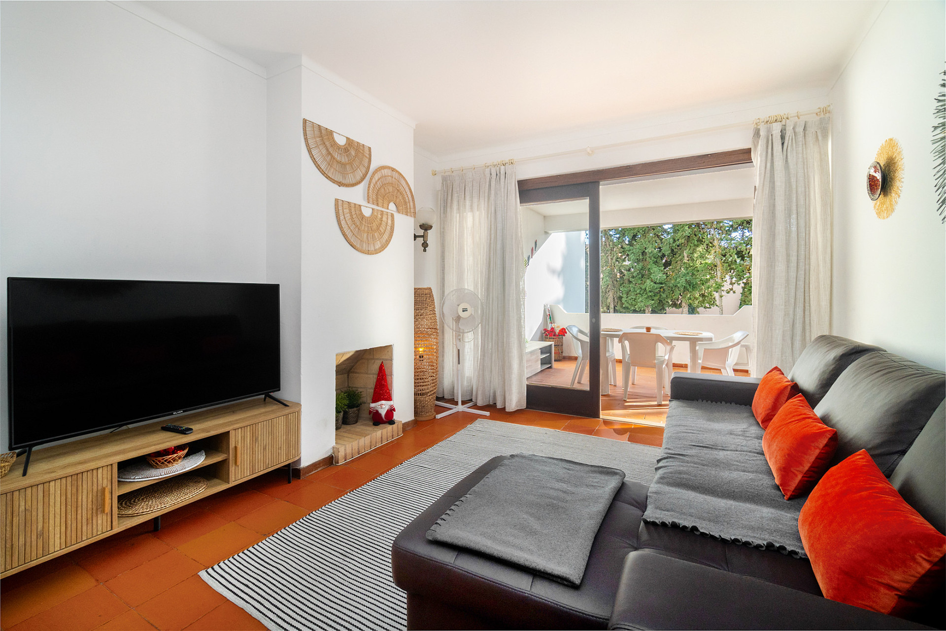 Living Room with a TV, Sofa and Dining Table