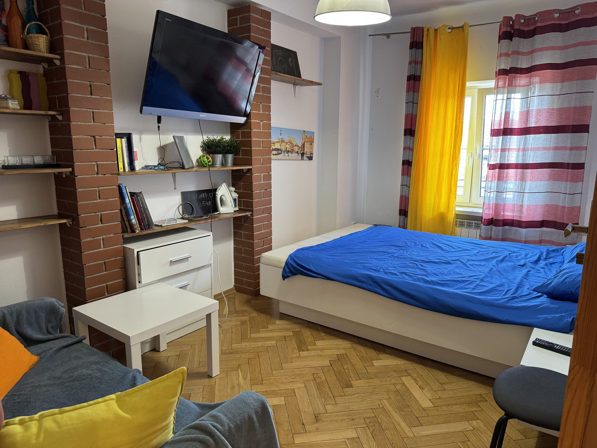 Bedroom with double bed and TV