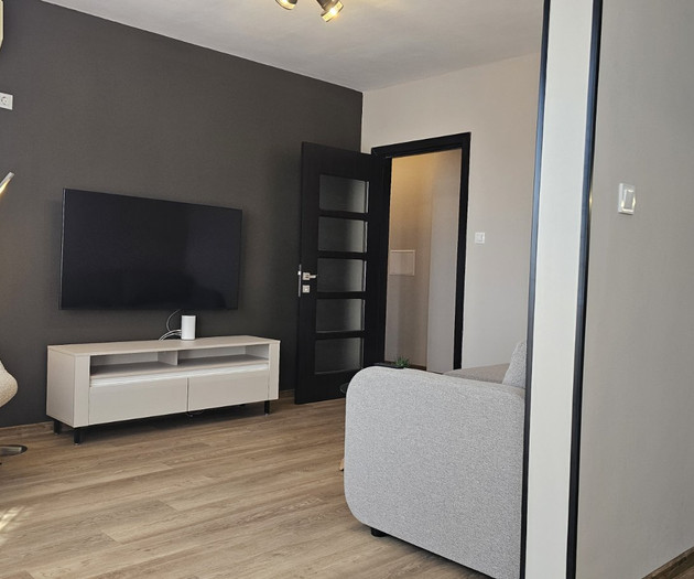 Living room with TV and kitchen