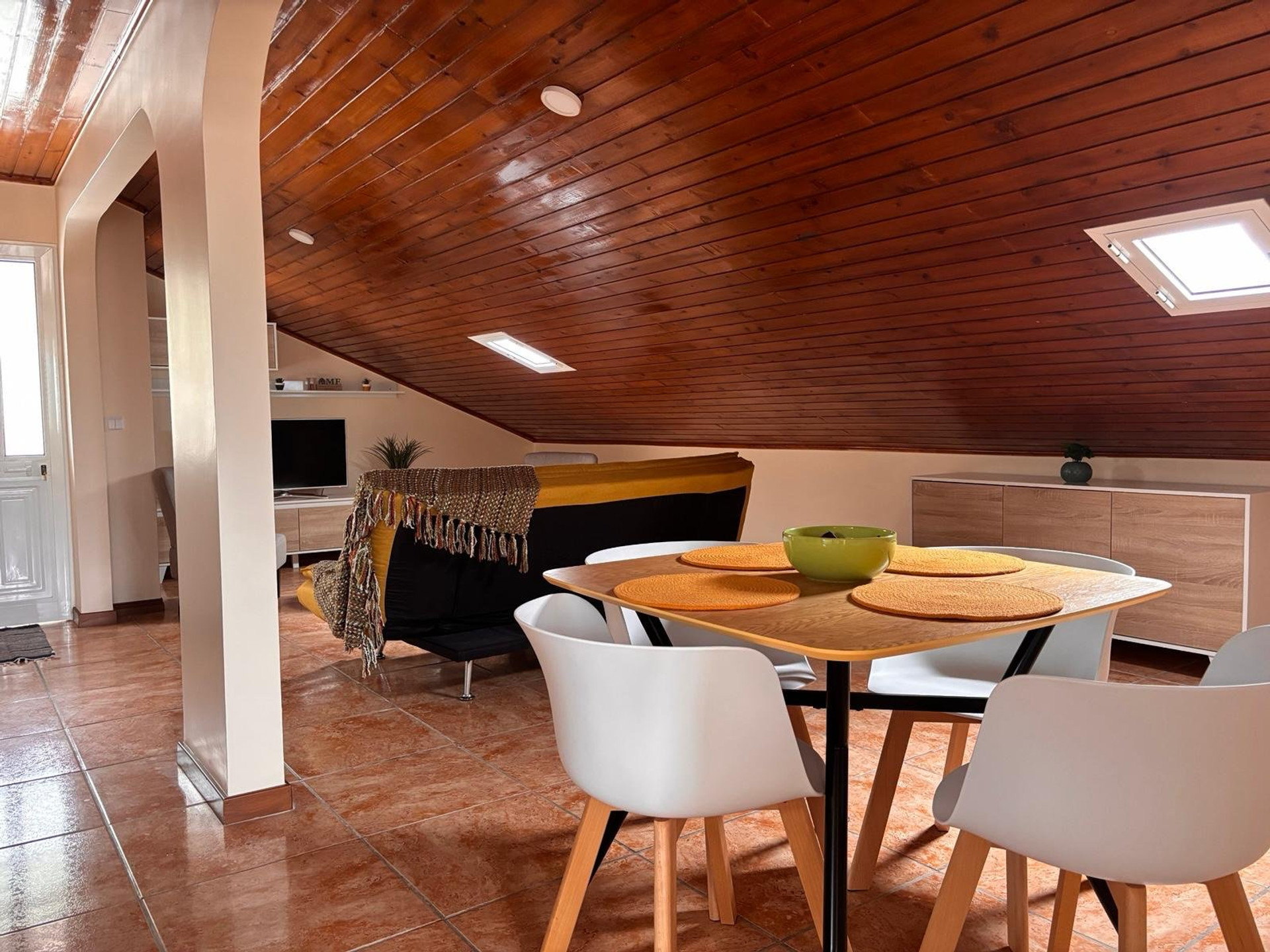 Dining area with wooden ceiling