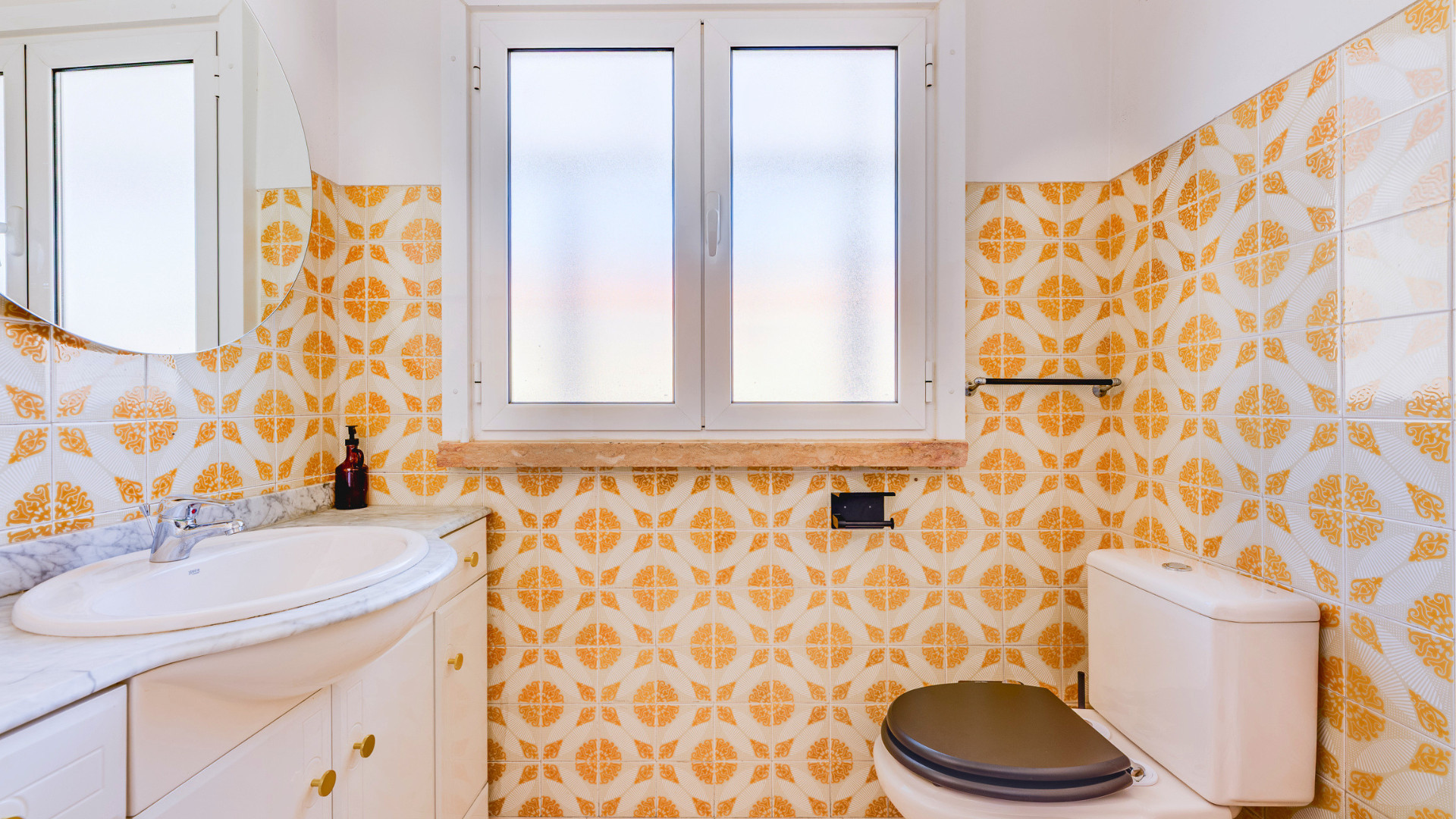 Bathroom sink and patterned tiles