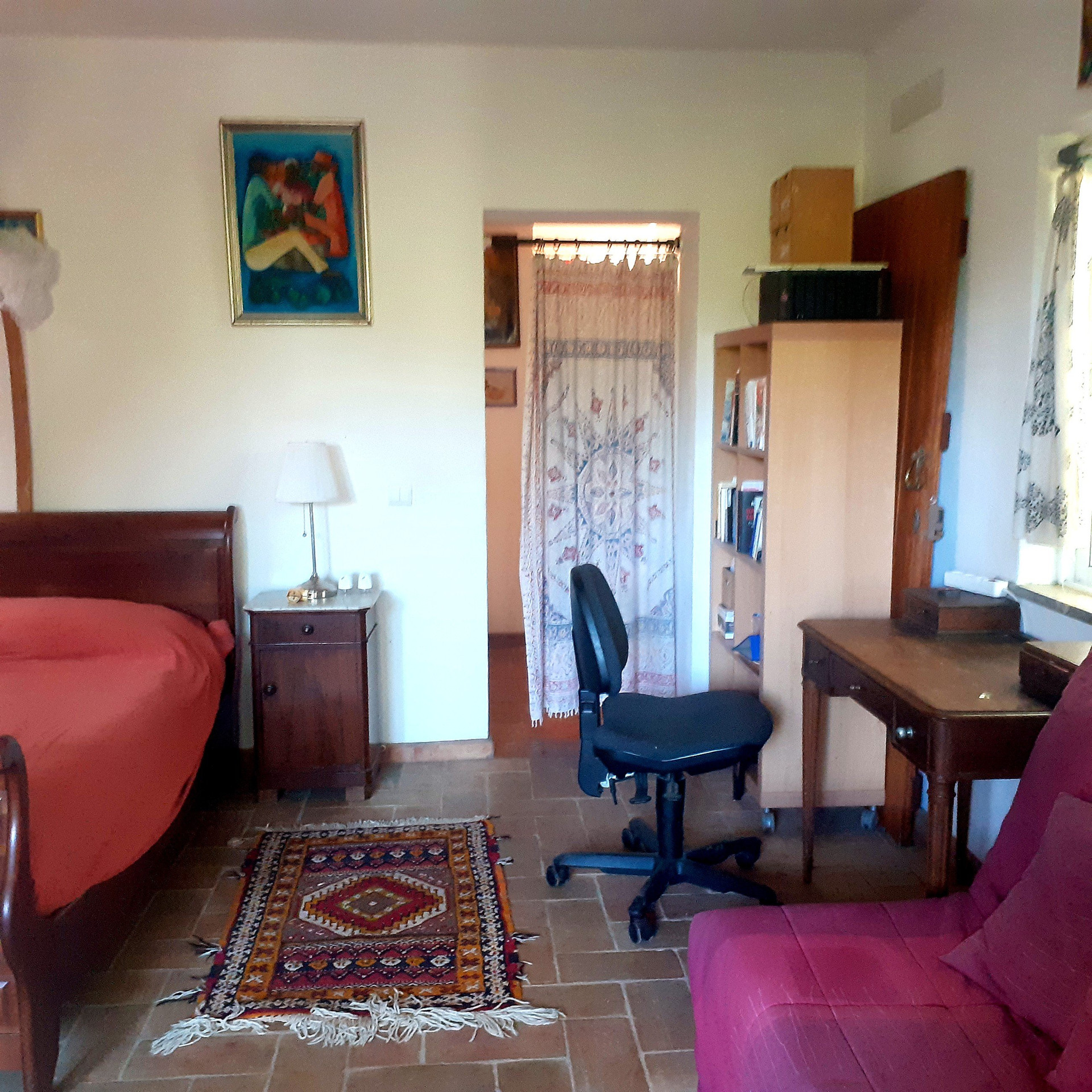 Bedroom with rug and desk