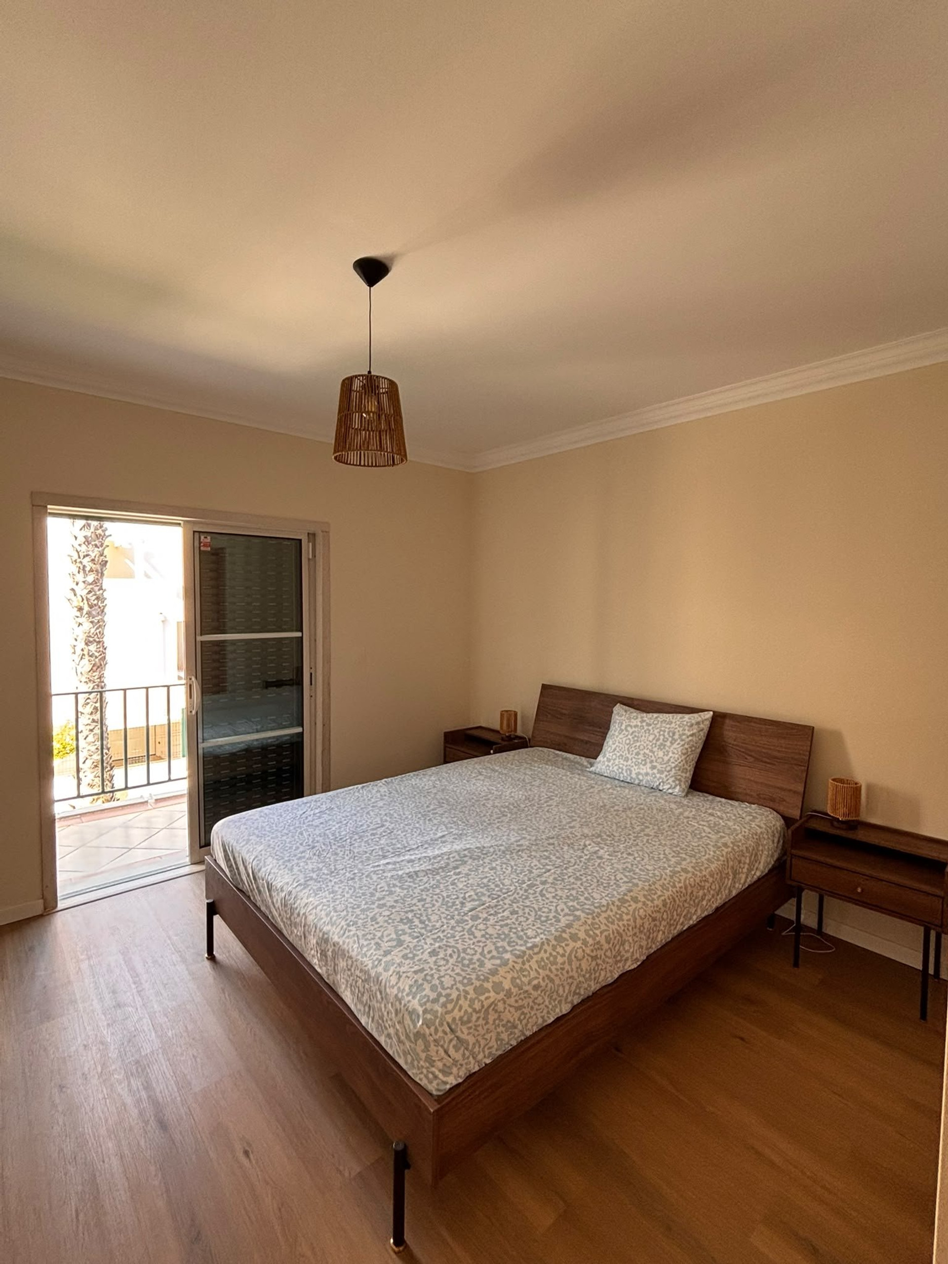 Bright bedroom with balcony access