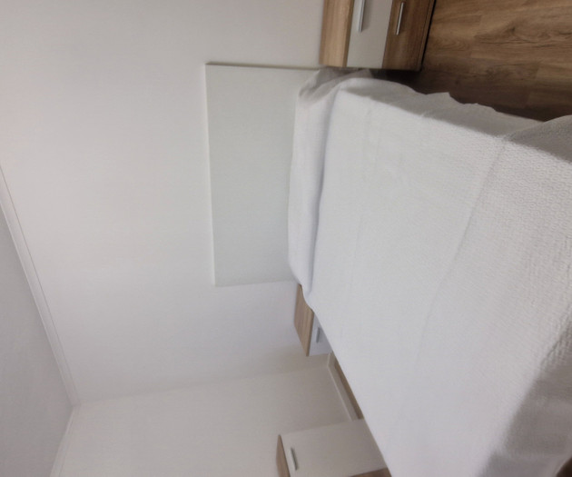 Close-up of bed and nightstand