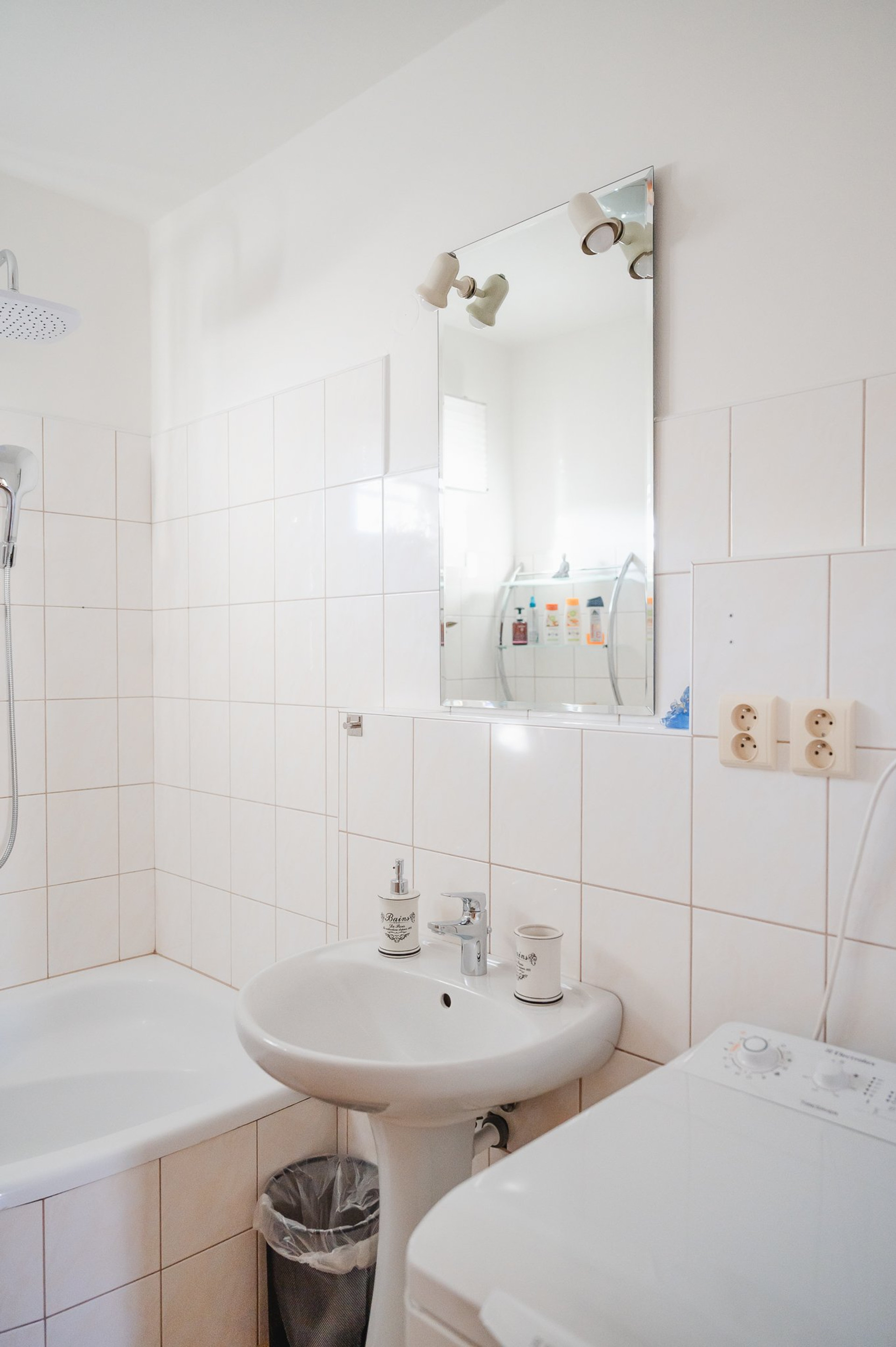 White bathroom with tub and sink