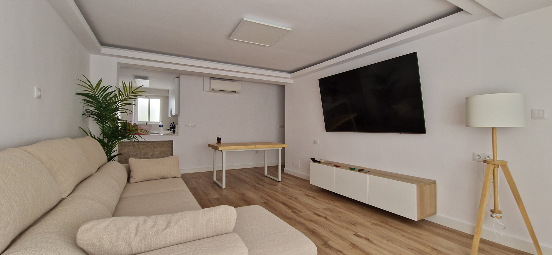 Bright living room with large TV