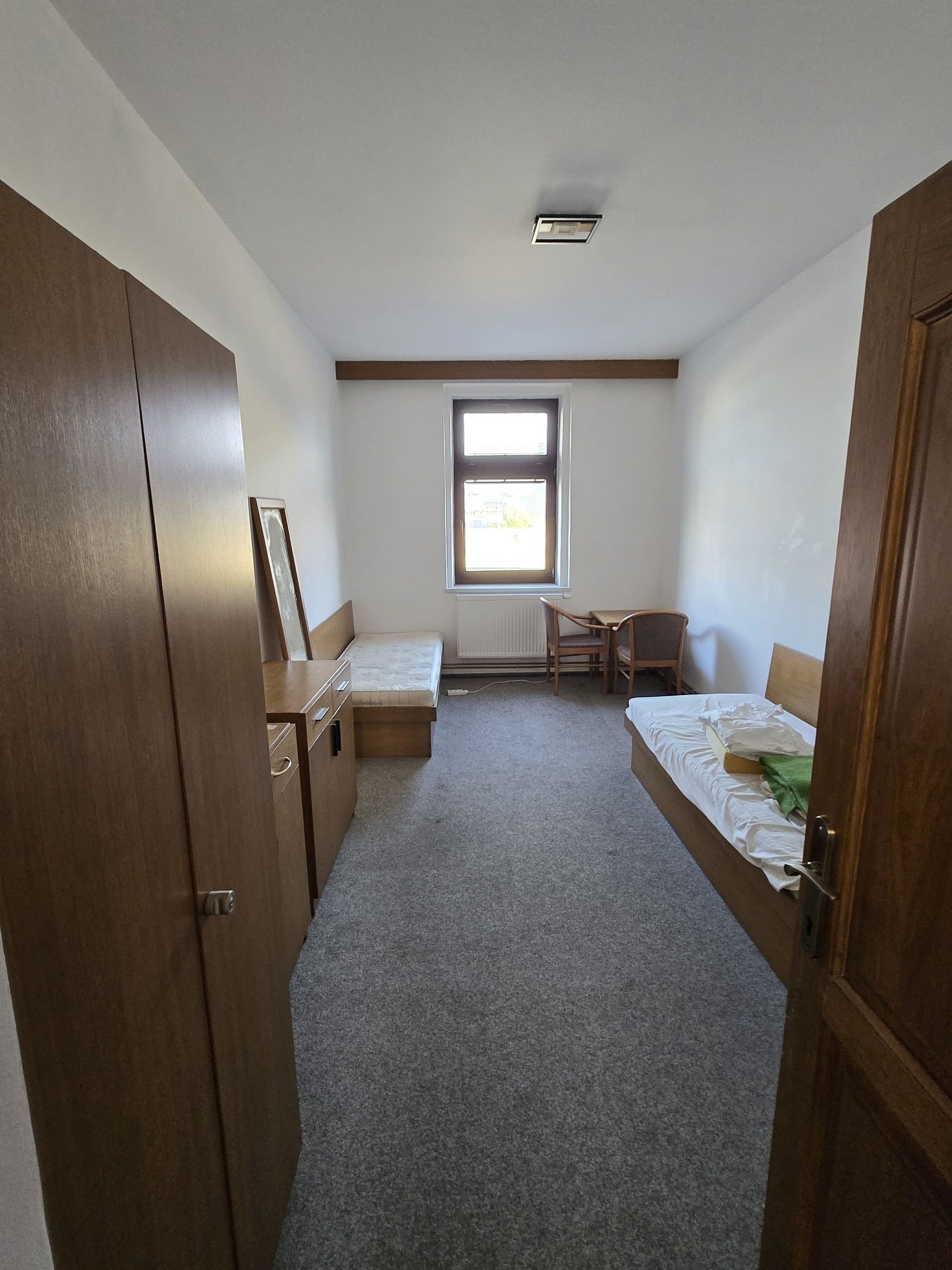 Bedroom with desk and bed