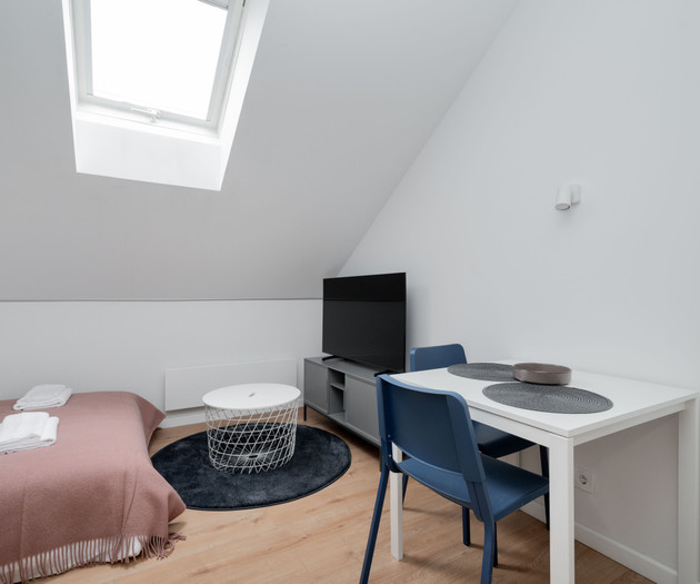 Bedroom with TV and dining table