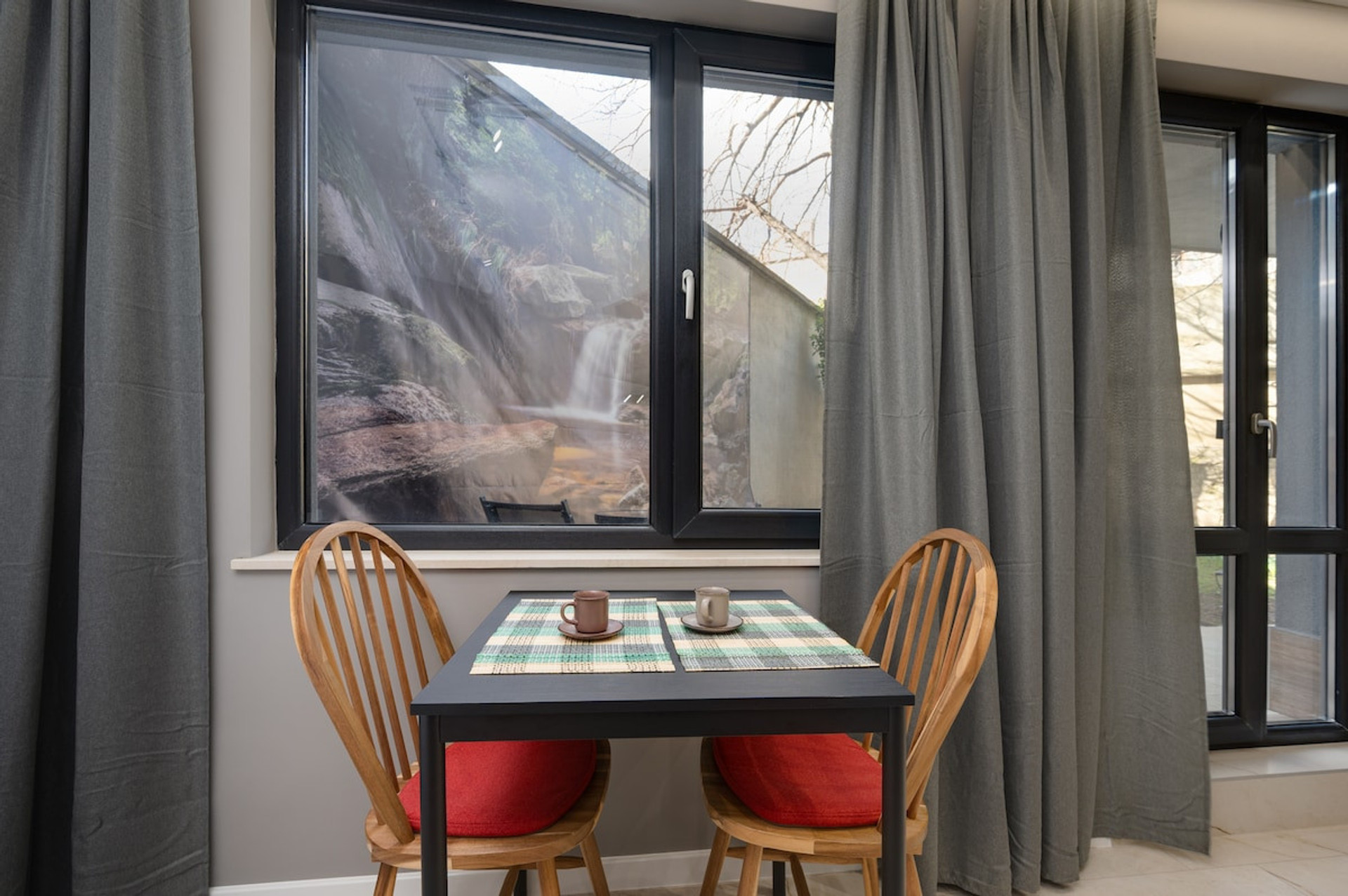 Enjoy your morning coffee or a romantic meal by the window, with unique artwork and garden scenery as your backdrop.