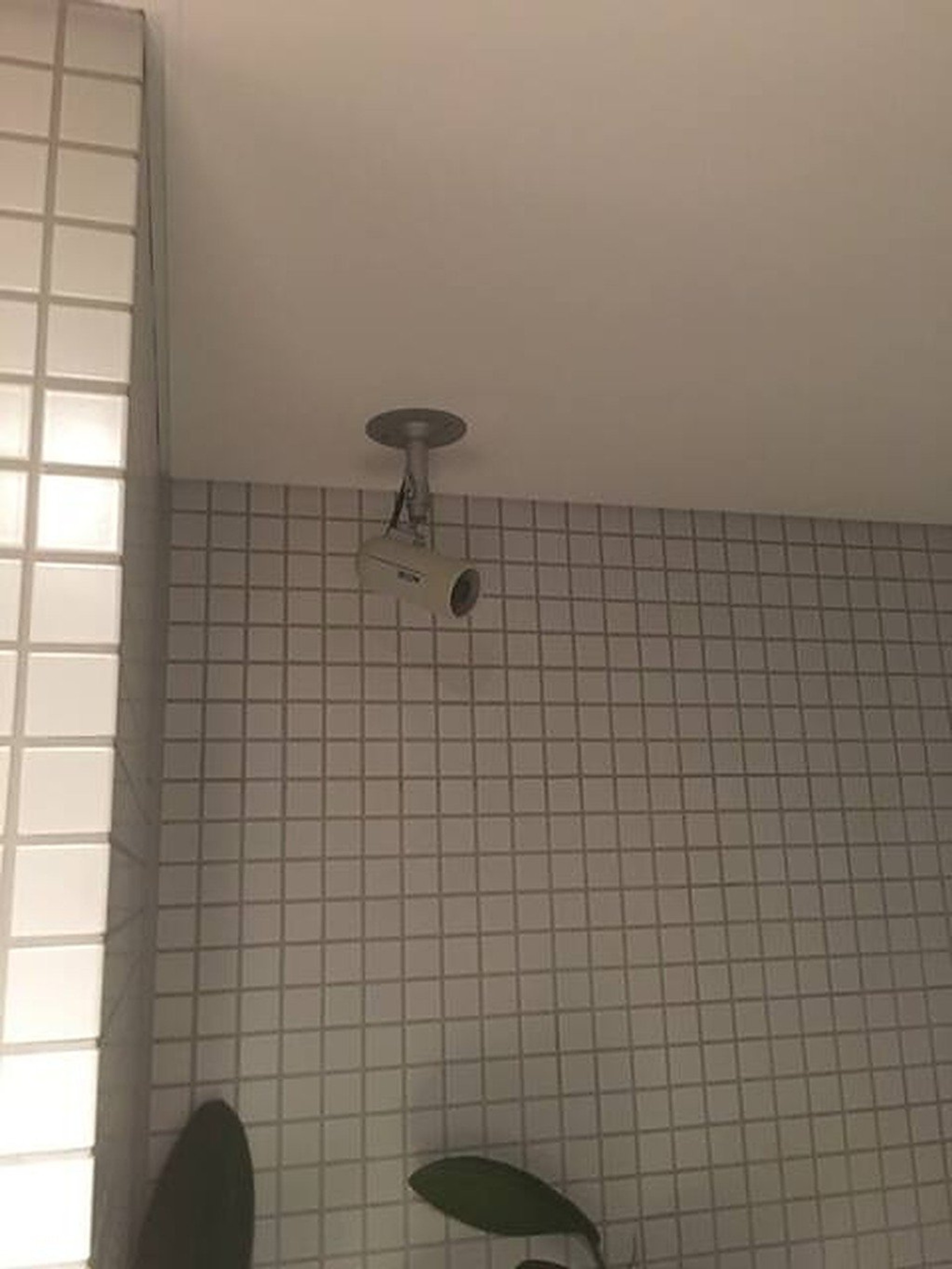 Tiled wall with ceiling fixture
