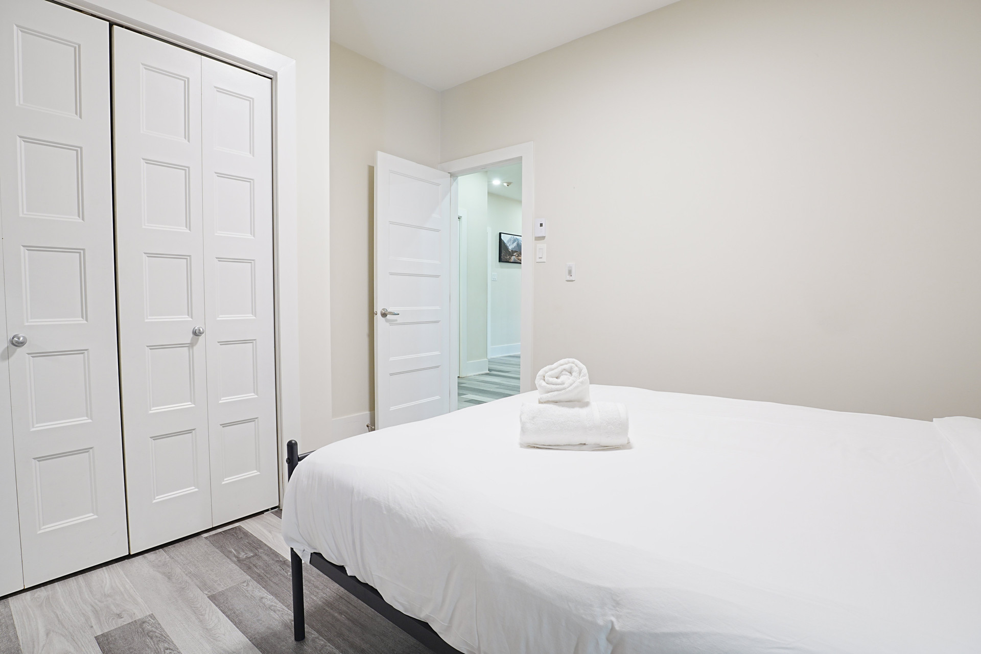 Bedroom with closet and towels