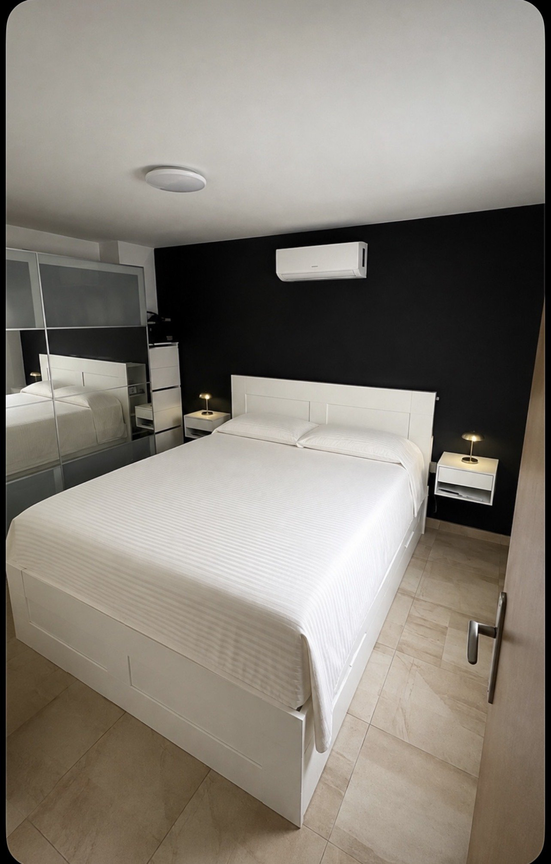 Bedroom with black accent wall