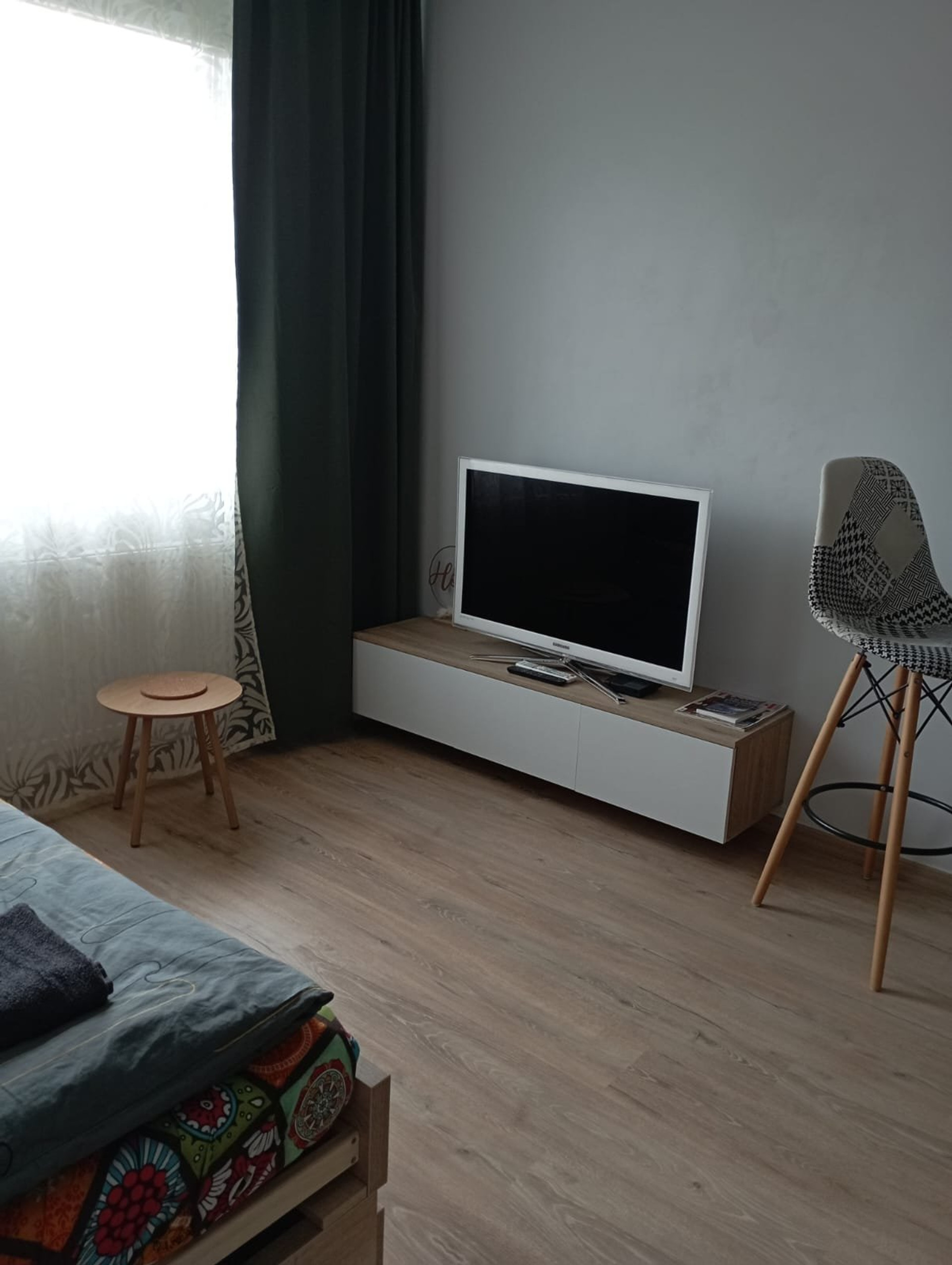 Bedroom with TV and seating