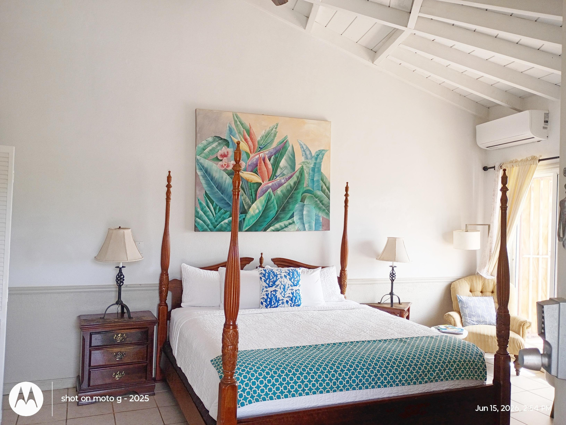Bright bedroom with tropical art