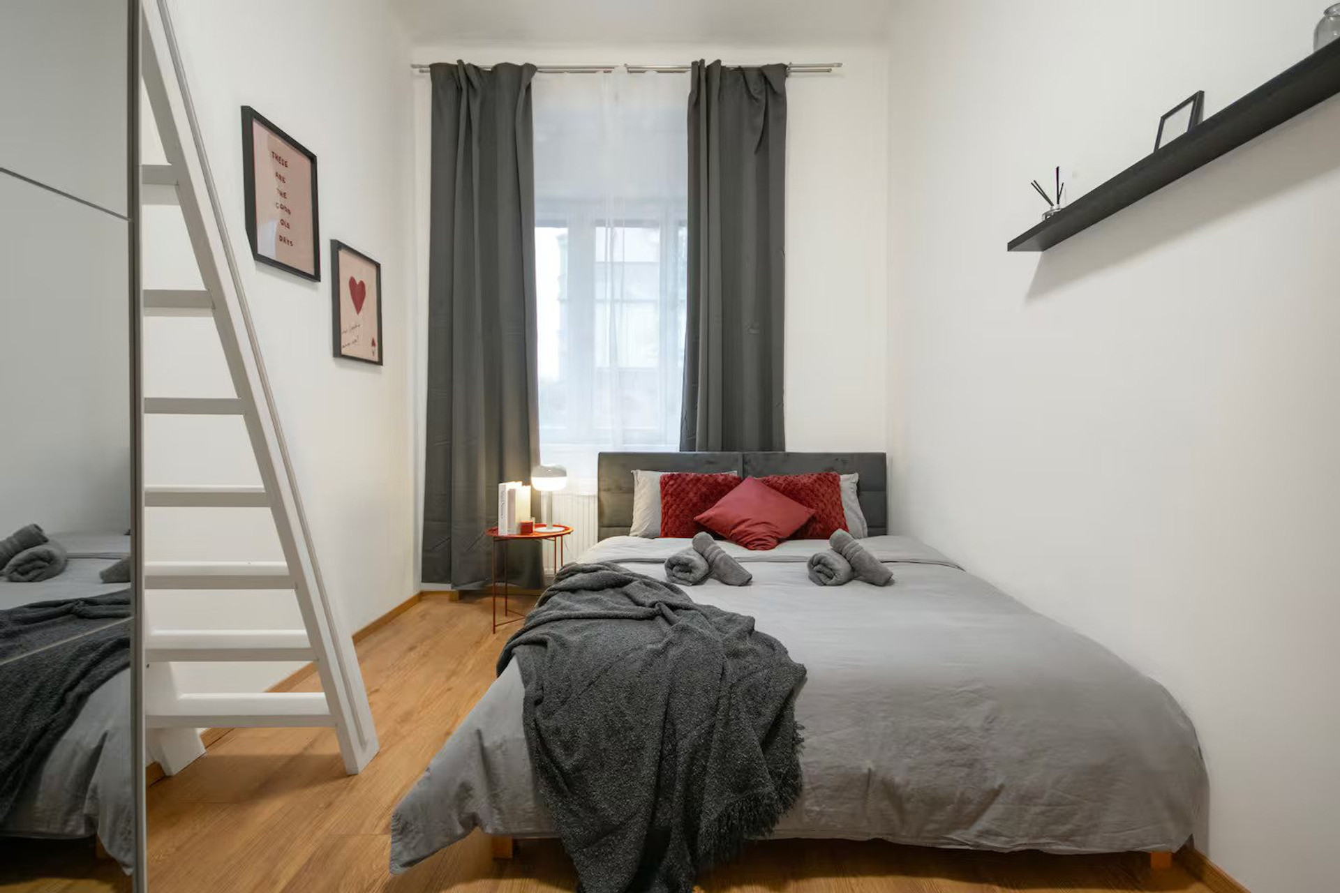 Bedroom with double bed and curtains