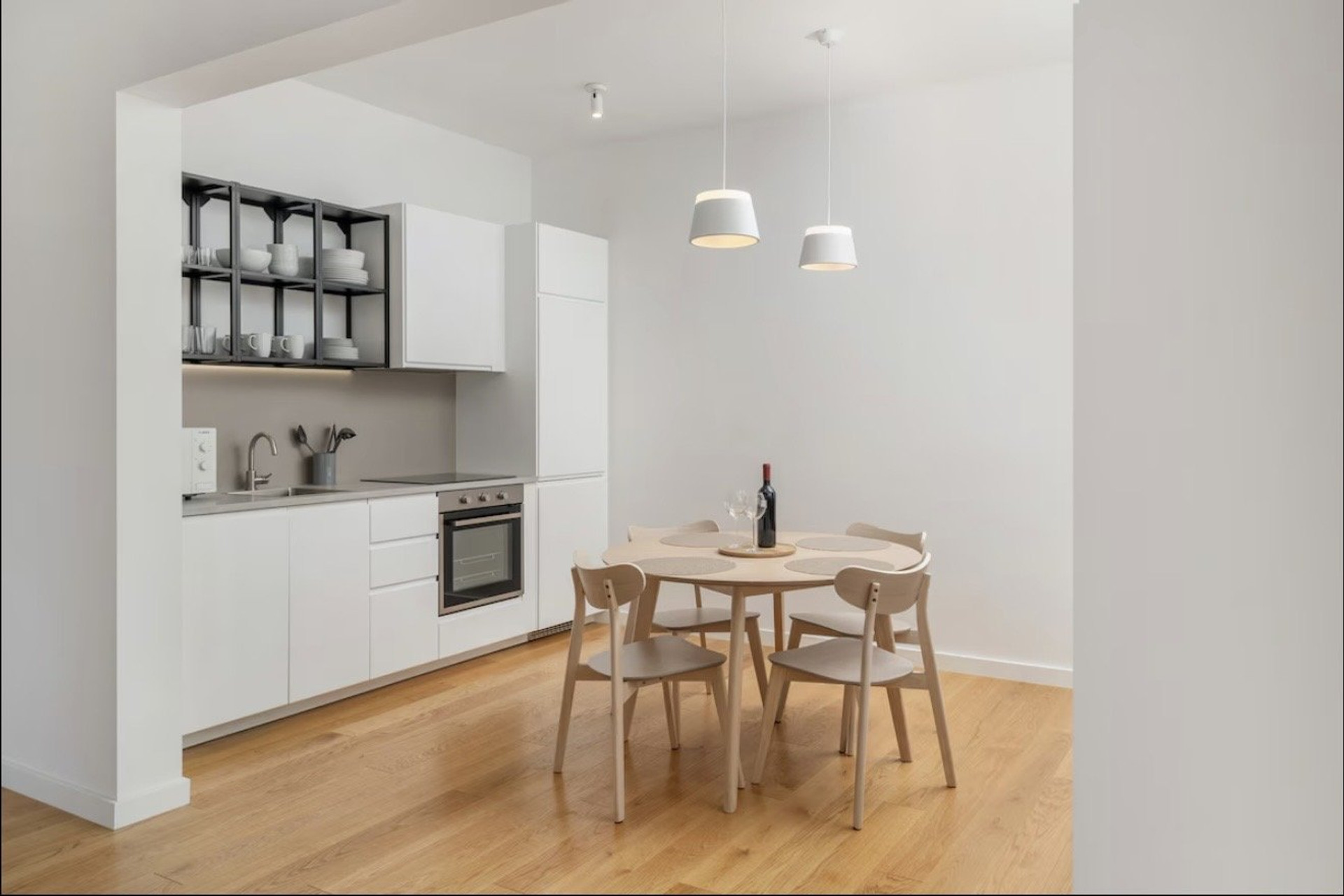 White kitchen with dining table