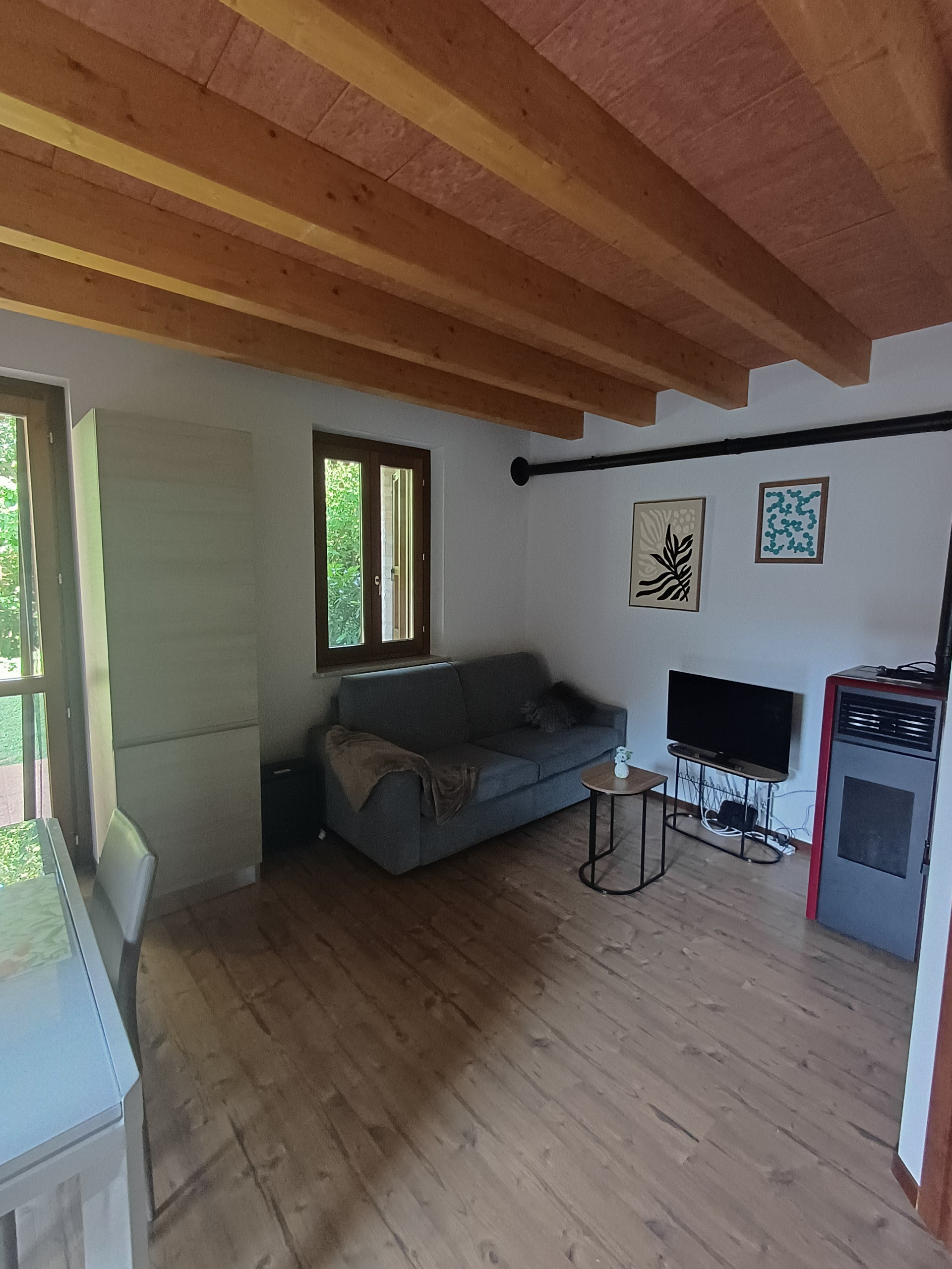 Living room with beamed ceiling