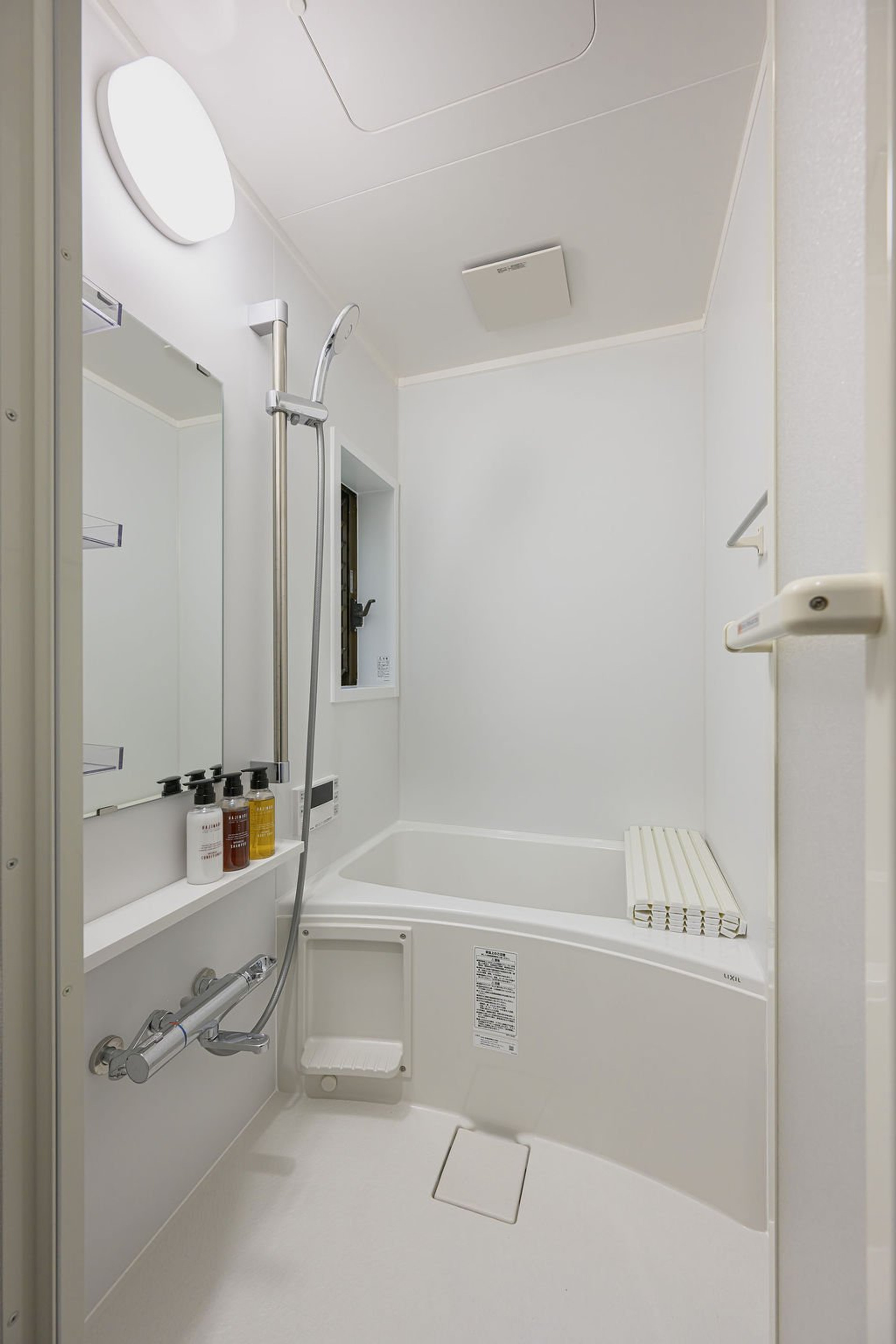 White bathroom with bathtub shower