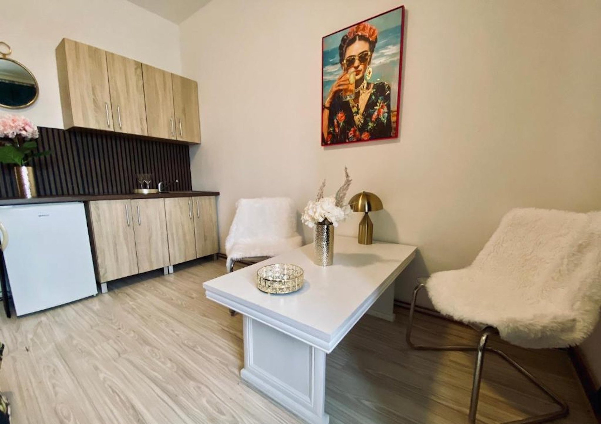 Living area with kitchenette and seating