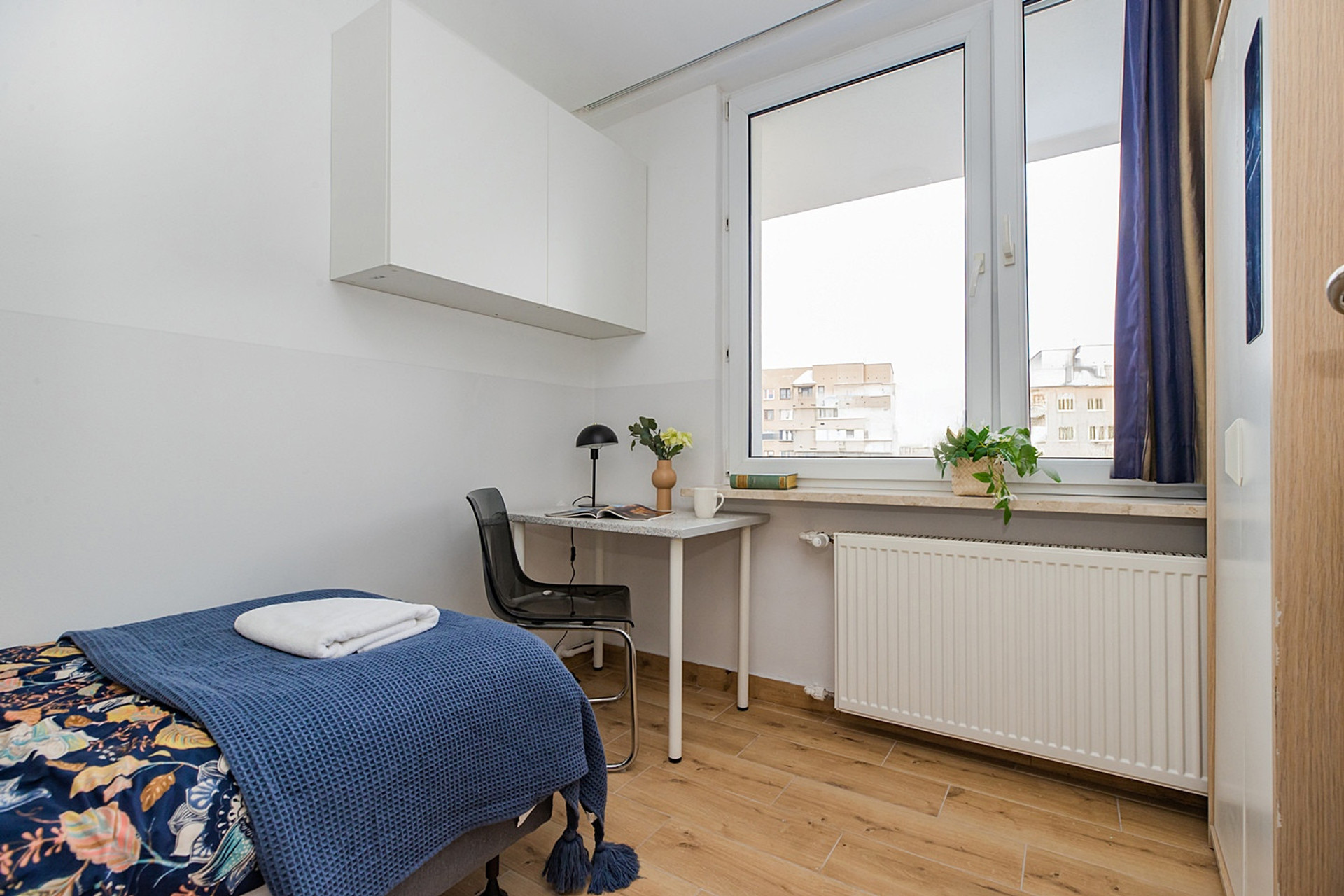 Bedroom with window and desk