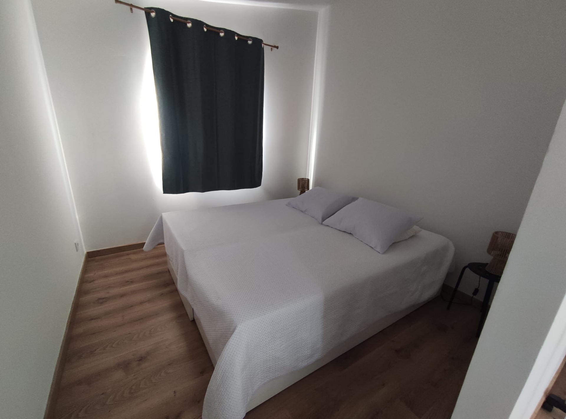 Bright bedroom with wood floors