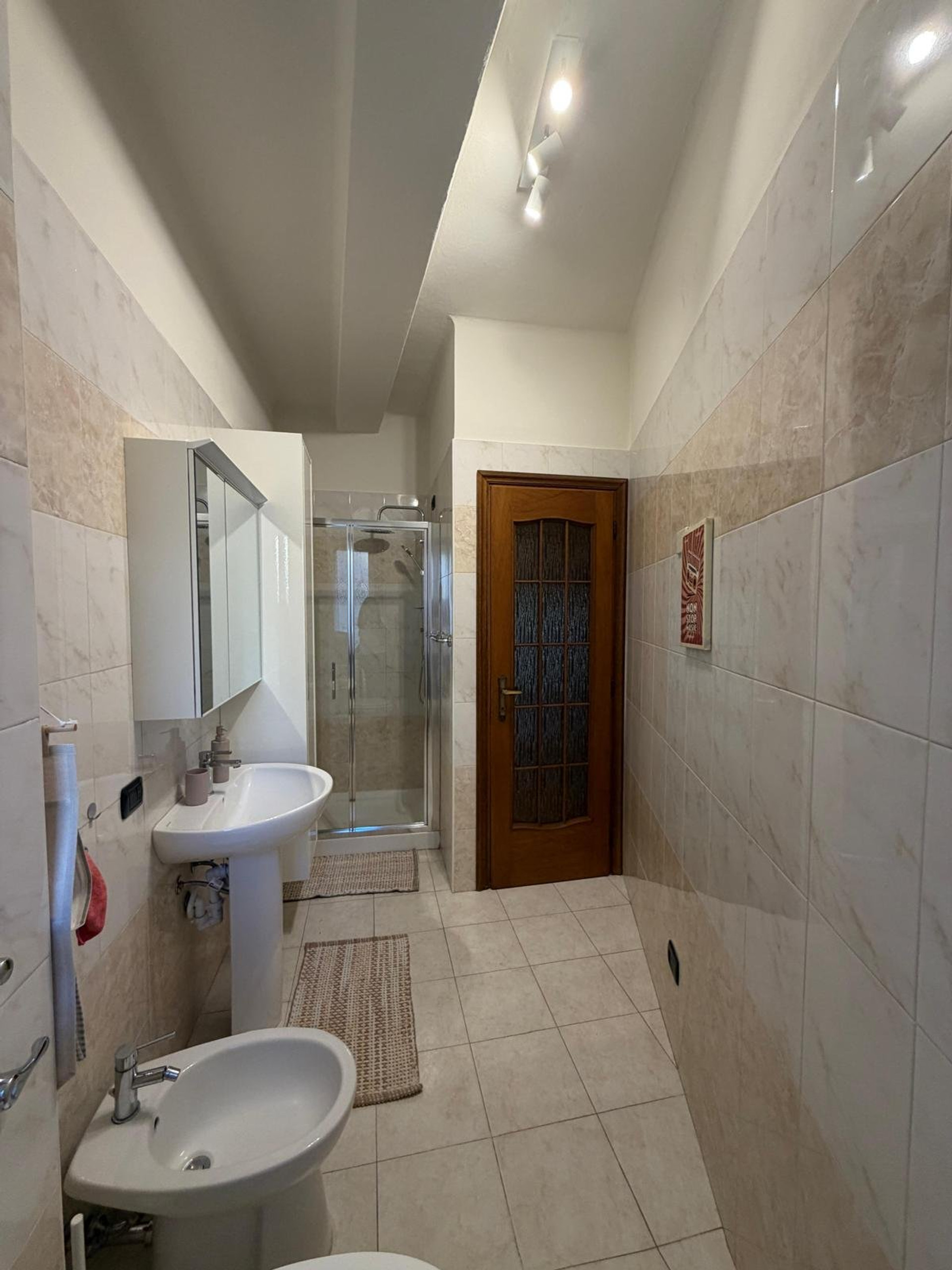 Bathroom with shower and bidet