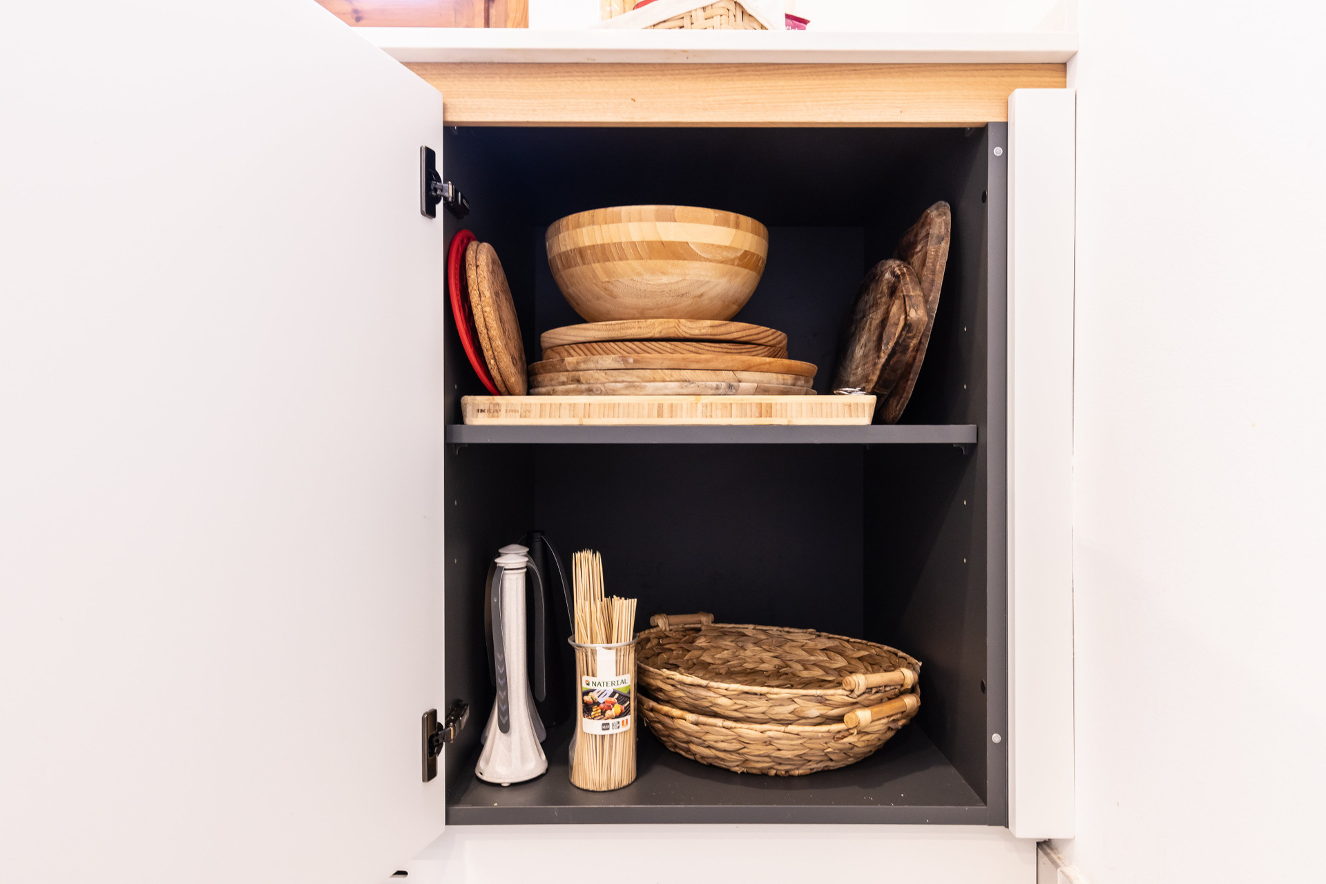 Kitchen cabinet with wooden bowls