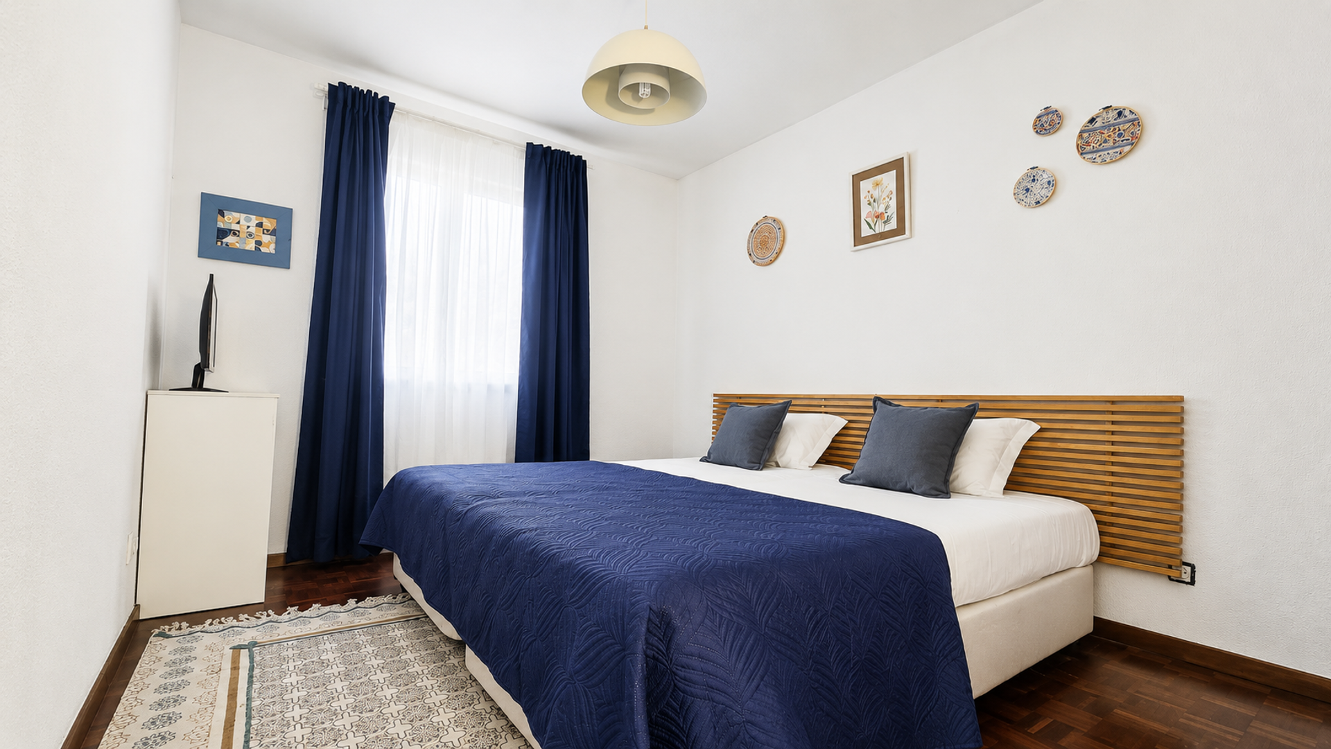 Bedroom with blue double bed