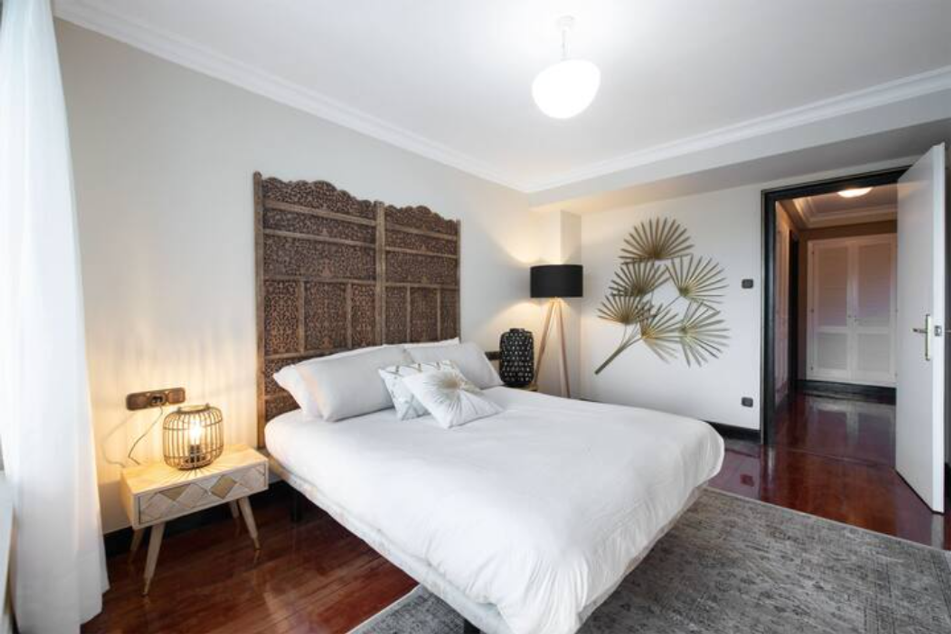 Elegant bedroom with carved headboard