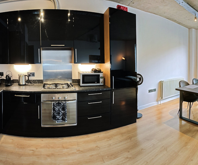 Black kitchen with dining area