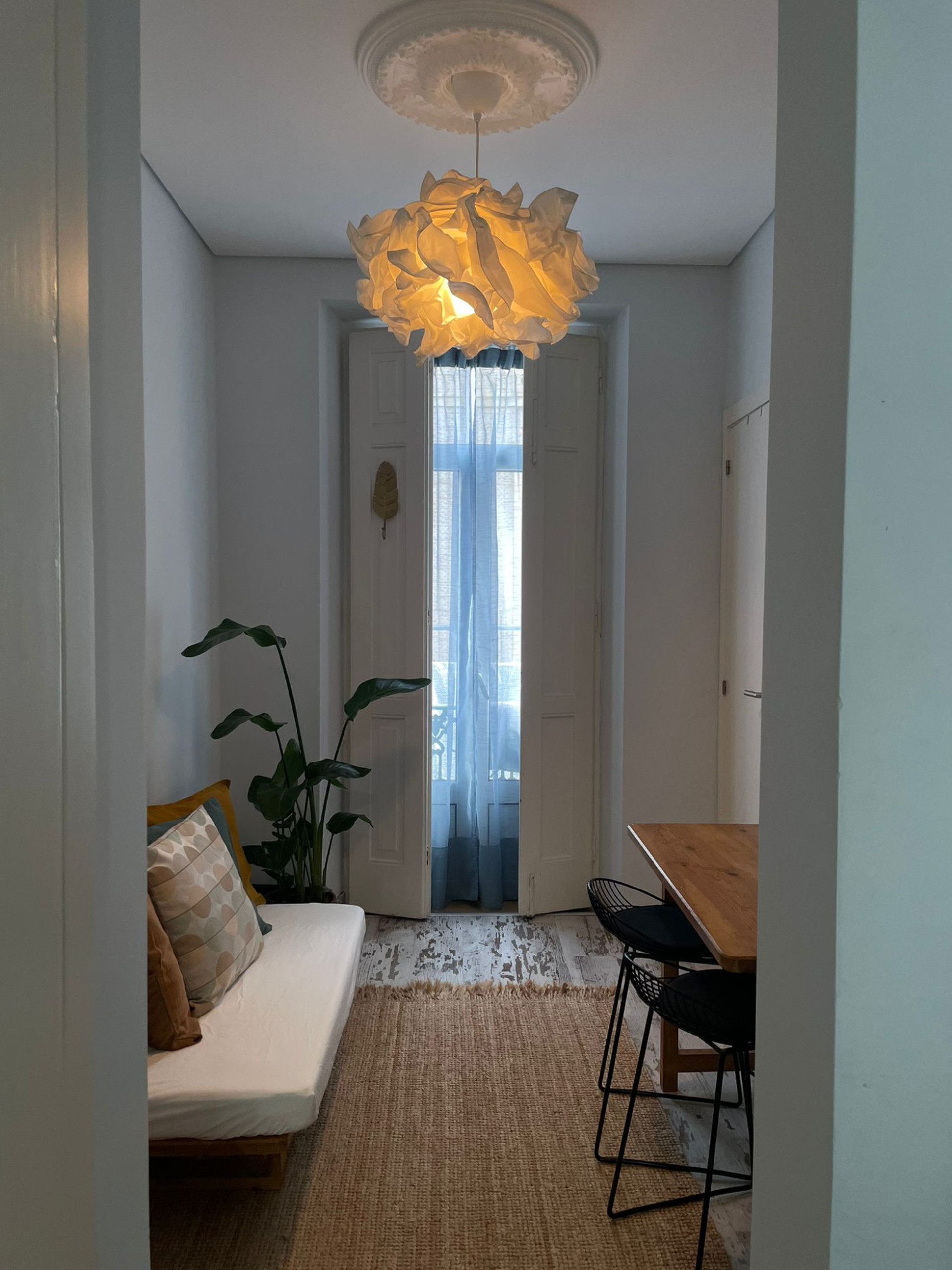 Living area with statement pendant lamp