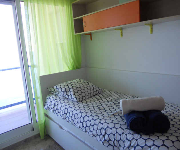 Single bed near window