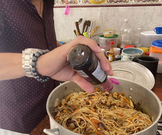 Man cooking pasta in kitchen