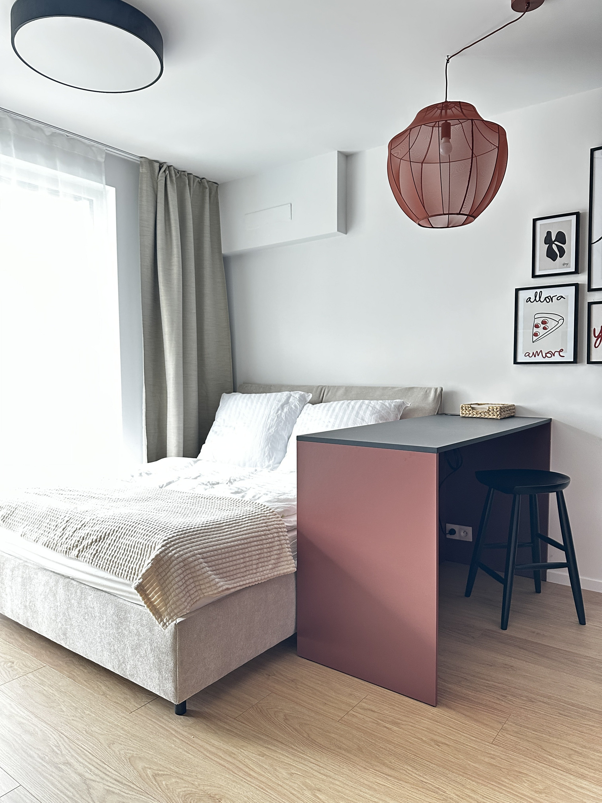 Bright bedroom with decorative wall art