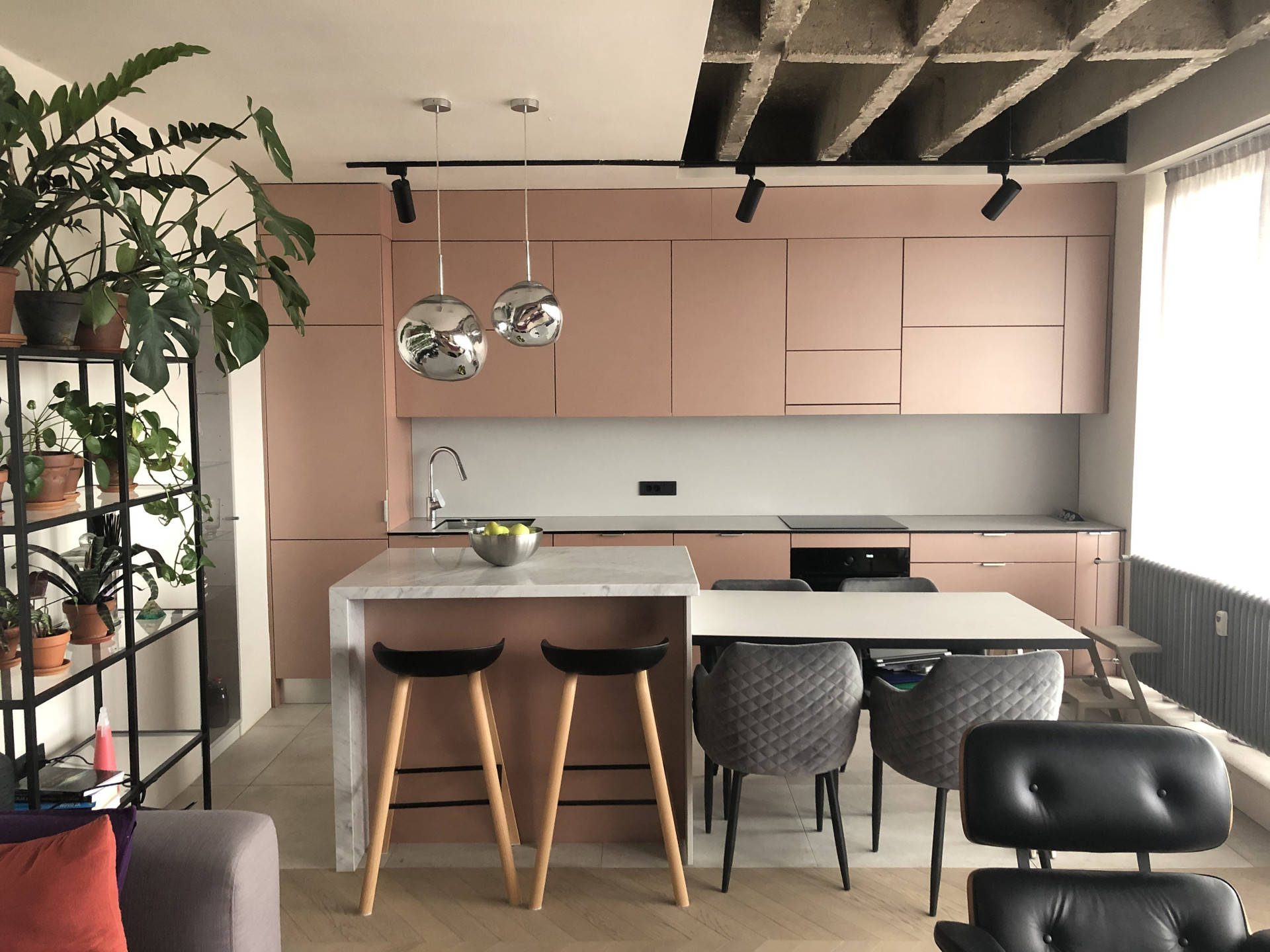 Pink kitchen with island and dining