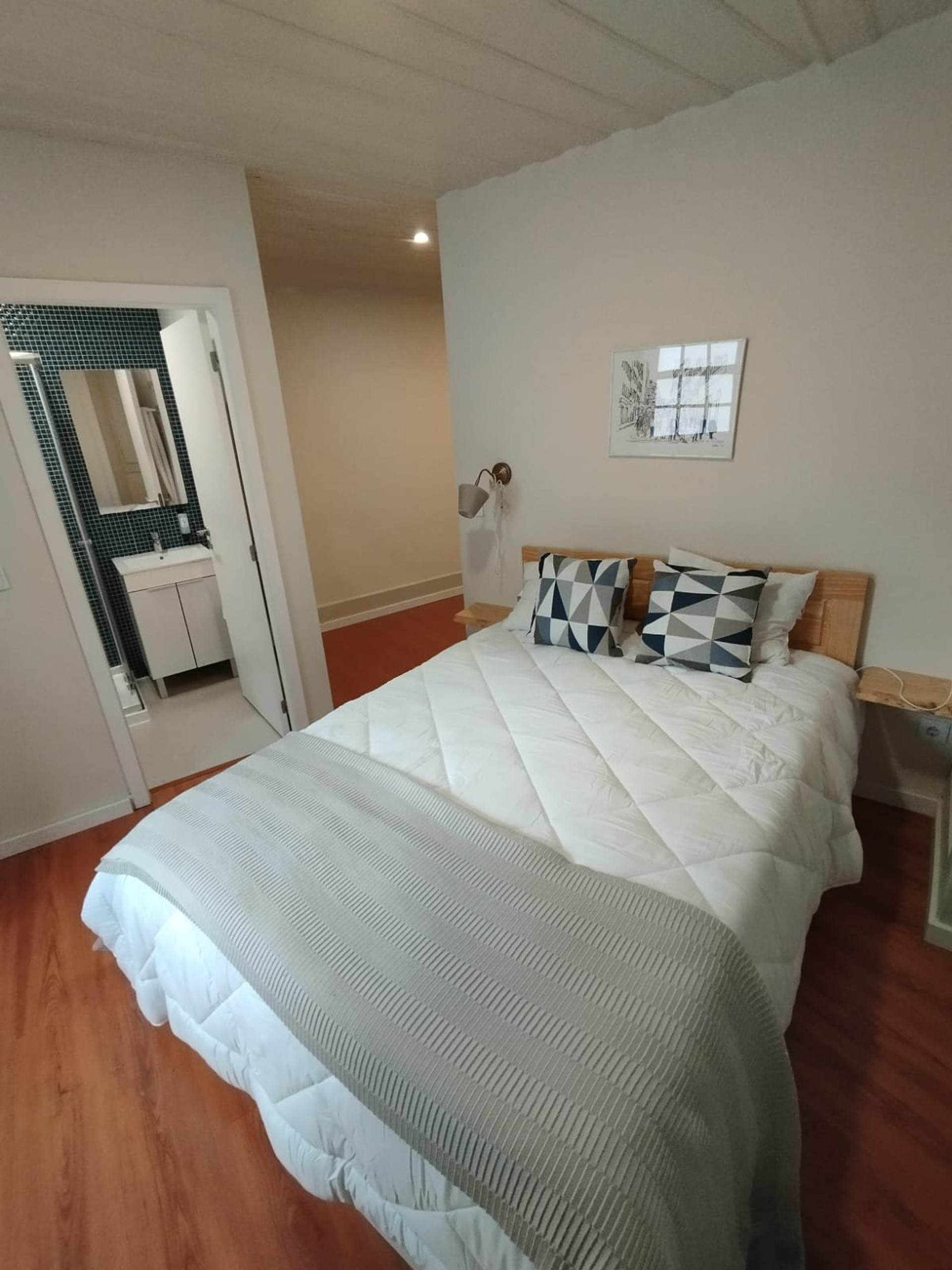 Bedroom with double bed and bathroom