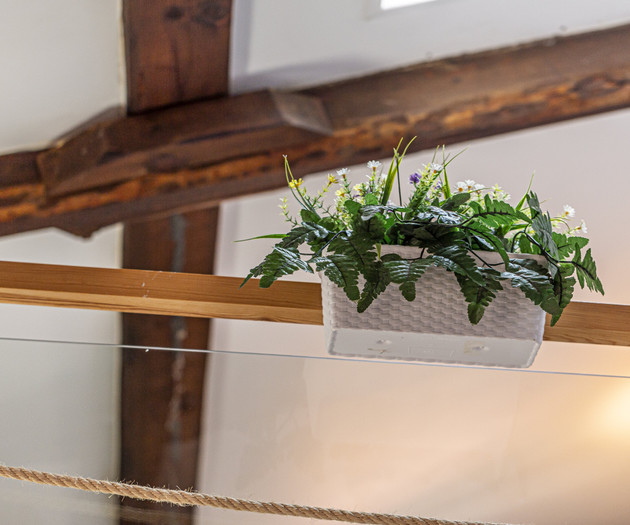 Flower planter on wooden beam